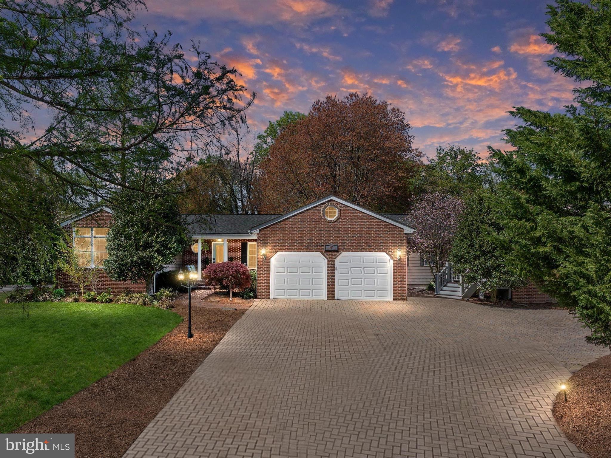 Welcome to 526 Broadneck Road, where every corner of this beautiful property feels like a breath of fresh air and every space invites you to slow down, stretch out, and savor the good life. From the moment you arrive, the warmth of the brick-front porch and the quiet charm of the swing beckon you to sit for a while and take in the view of the manicured lawn and garden beds. Step inside, and the home instantly wraps you in a sense of grace and ease—wide hallways, rich hardwoods, and soft natural light set the tone for a life well lived. The heart of the home flows effortlessly from room to room, with tall ceilings, architectural trim, and open sightlines that create both grandeur and intimacy. The fireside family room feels like the place where laughter lingers long after the guests have gone. The gourmet kitchen is not just for cooking—it’s for gathering, connecting, creating memories. With its oversized island and chef-grade features, it’s where mornings begin and holidays are made. Nearby, the sunroom is a sanctuary—radiant heat warms the floors underfoot while cathedral ceilings soar above, and doors open to a dreamy outdoor haven complete with a sparkling pool, gardens, firepit, and space to dance under the stars. Every bedroom is a private retreat, designed with comfort and quiet in mind. The primary suite is indulgent in the best way—expansive yet cozy, anchored by a fireplace and wrapped in calm with its own spa-like bath and private sunroom that feels like your own corner of paradise. Even the lower level, with its kitchenette and full suite, echoes the same thoughtful design and effortless style. And just steps away, a detached guest cottage provides the perfect space for visiting friends, a home office, or an inspiring studio—bathed in light and overlooking the pool, it’s a peaceful hideaway with a world of possibility. This home isn’t just beautiful—it lives beautifully. It’s made for multigenerational living, for hosting joyful celebrations and quiet Sunday mornings, for kids splashing in the pool and stories shared by the fire. It's a place where everyone has room to be together and space to be themselves. Tucked into one of the most desirable neighborhoods in the area, with top-tier schools and unbeatable access to shopping, dining, and the Bay, this is more than a home—it’s a lifestyle, and it’s waiting for you.