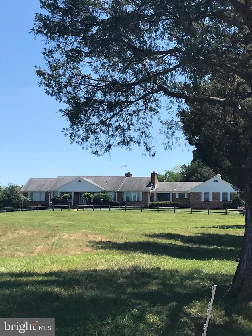 Huge Brick front rambler/ranch style home. Custom built and top of the line in its day. The bones and foundation of the home seem in good condition, but the interior needs some updating Paint, floors, bathrooms and counter tops. Lots of space, two hot water heaters and dual zone AC.  This is a must see the details and space is not found in modern homes, from the privacy doors that shut off the main living area from bedrooms, to the fully floored attic, this house has got space Bedrooms and Bathrooms are plentiful, just a little imagination, TLC and your updating touch will make this house great again! Over 54 acres with cross fencing and automatic waterers in every paddock. Barn, sheds and office/ studio. This is a true farm to bring cattle and livestock to and enjoy country living close to Gainesville, Nokesville and Warrenton.