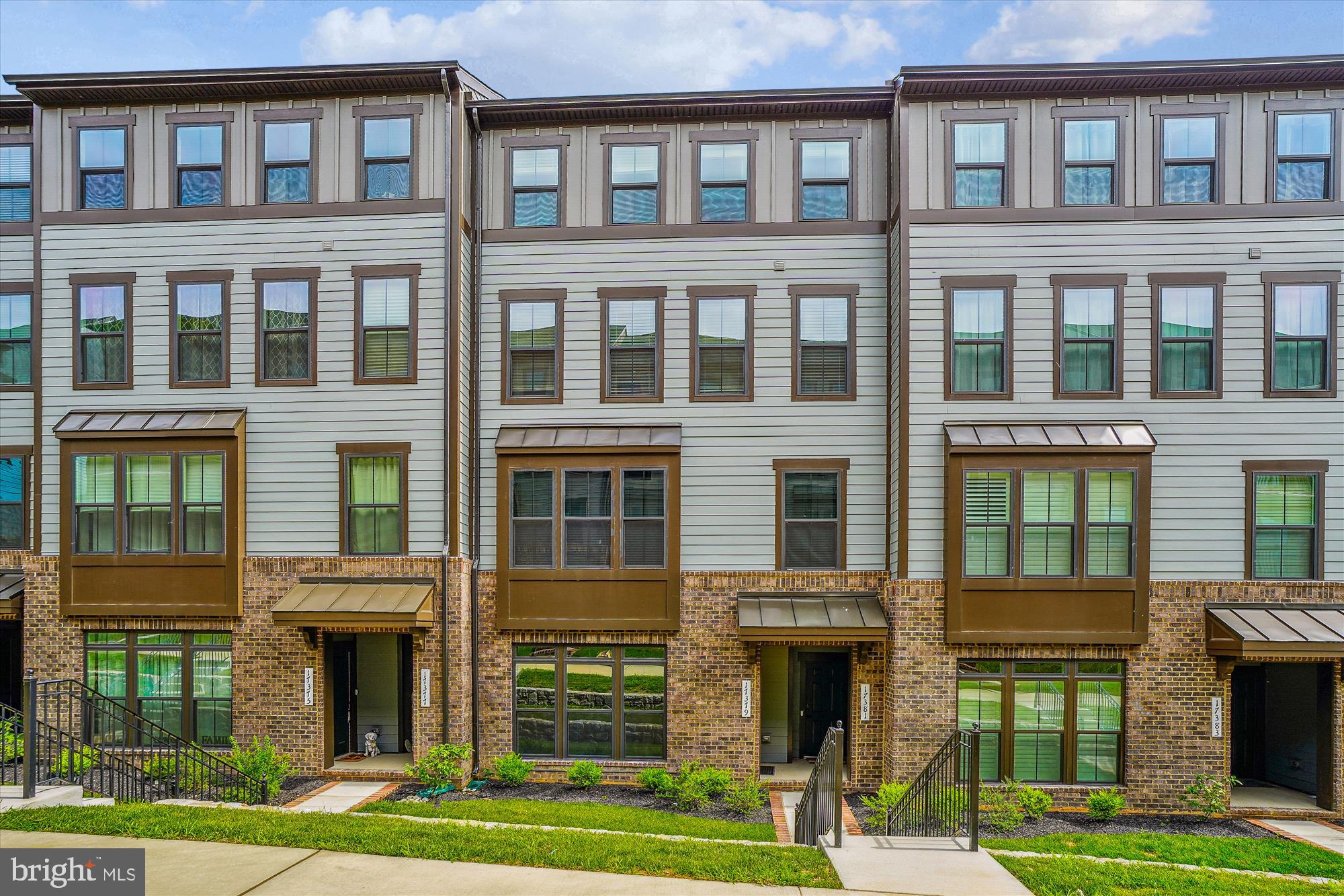 Stunning Condo-Style Townhome in Sought-After Potomac Shores! This beautifully designed home features luxury vinyl plank flooring throughout the main level and a spacious open-concept layout. The gourmet kitchen boasts stainless steel appliances, a large center island with bar seating, and stylish pendant lighting. Enjoy meals in the separate dining area and relax in the expansive family room, complete with a ceiling fan and access to a luxurious covered balcony—featuring its own ceiling fan and cozy fireplace, perfect for year-round enjoyment. Upstairs, you'll find three generously sized bedrooms. The primary suite offers a tray ceiling, walk-in closet, and a spa-like en-suite bathroom with a tiled shower and private water closet. Two additional bedrooms share a full hallway bath. Additional features include a 1-car garage equipped with an EV charging outlet. Included in the rent: washer and dryer, Wi-Fi, trash service, and lawn maintenance. Enjoy resort-style amenities just steps away, including a golf course, two pools, and playgrounds all within walking distance. Situated in a prime location, this property is just minutes from I-95, Quantico, and an array of shopping and dining options. The community amenities are second to none. Residents of Potomac Shores enjoy exclusive access to a 13,000-square-foot indoor/outdoor playground, a Social Barn for gatherings, a Fitness Barn with a modern gym, movement studio, and yoga lawn, as well as a family pool with a sundeck, cabanas, kids’ pool, and snack bar. Outdoor enthusiasts will appreciate the 5+ miles of trails for running, biking, or walking, as well as opportunities to launch a kayak, join social clubs, or play a round of golf at the Potomac Shores Golf Club – the only publicly accessible Jack Nicklaus Signature Design course in Northern Virginia. With convenient commuting options to Quantico, Ft. Belvoir, and the Pentagon, this home offers an unbeatable combination of luxury, convenience, and community. Don’t miss the rare opportunity to own a one-of-a-kind custom smart home in the vibrant Potomac Shores community!