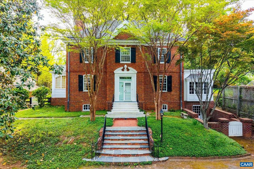 Available for the first time since 1987, this 1935 Georgian Revival estate, designed by esteemed architect Milton Grigg, offers a rare opportunity in Charlottesville?s coveted Lewis Mountain neighborhood. Crafted of hand-laid brick in Flemish bond beneath a slate roof and approached by marble steps sourced from Monticello, the residence embodies timeless architectural pedigree. Facing east toward the University of Virginia?s Academical Village, the property features 4 bedrooms, 4.5 baths, soaring ceilings, intricate moldings, and a sweeping curved staircase. A detached guest cottage, circular drive, and private gardens with brick walkways and a raised water feature complete the expansive double lot. Poised for thoughtful restoration and potential expansion, this historic property awaits its next steward to honor and enhance its extraordinary legacy. A short stroll from the Rotunda and the Lawn, and an easy drive from all of Charlottesville.,Fireplace in Basement,Fireplace in Living Room