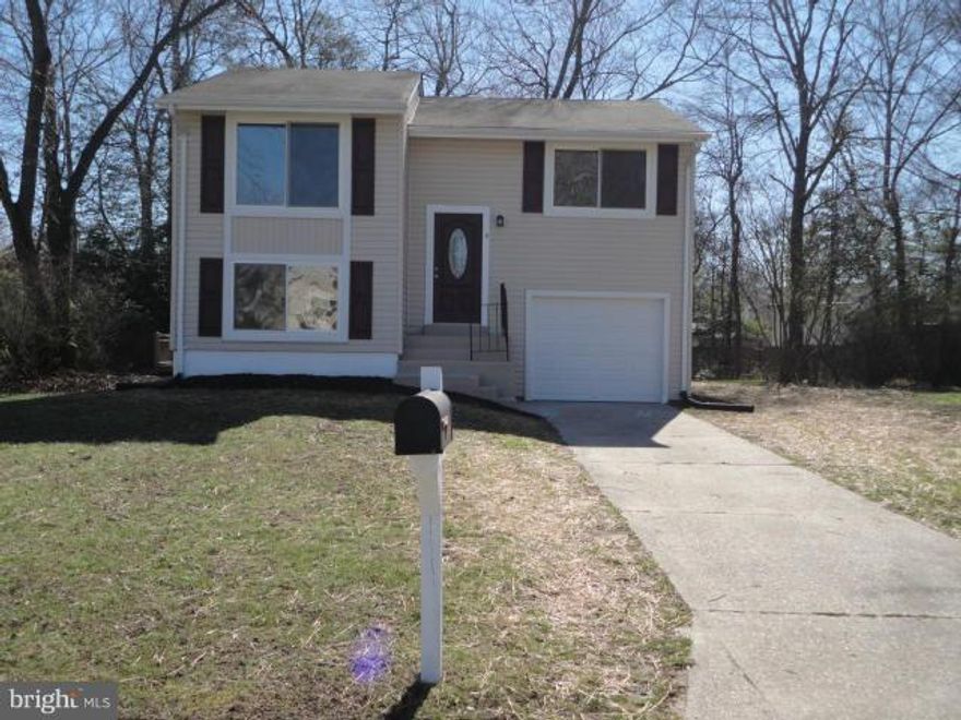 Stunning renovation.  Home has been completely remodeled featuring kitchen w/espresso cab; granite, recessed and under cab lighting; SS appliances; baths w/custom tile and lighting and quartz top vanities; hardwood floors; huge deck; new HVAC and more.