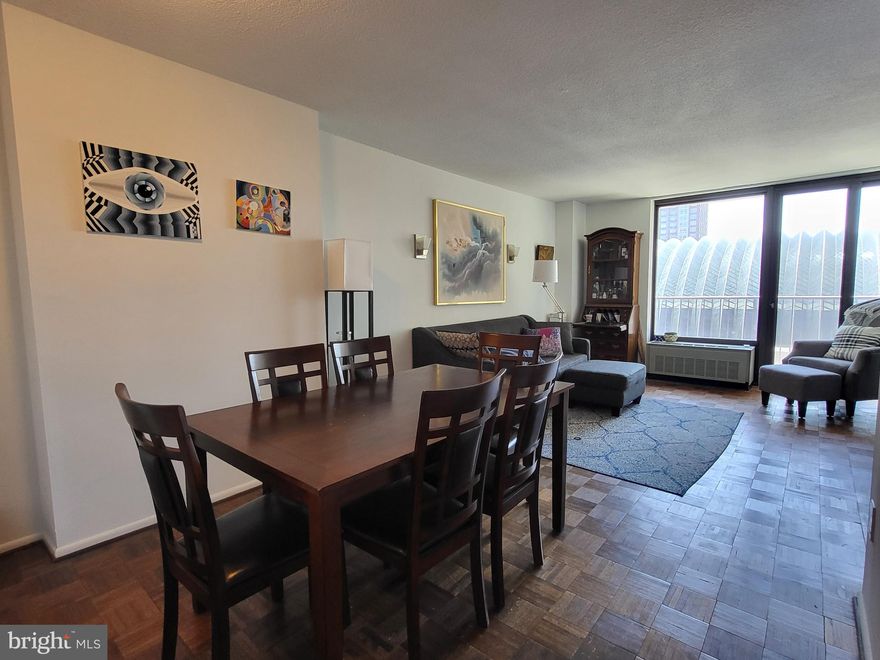 Light-filled and spacious one bedroom, one bathroom at Academy House. The residence offers a sun-soaked living/dining room that leads to the private balcony showcasing southern city views; separate galley style kitchen with ample modern cabinetry, granite countertops, designer tile backsplash, stainless steel appliances, and a tile floor; generously sized bedroom suite with excellent closet space; and a full hall bathroom with a large modern vanity with granite top , tub shower, and laundry closet with stacked washer/dryer. There are parquet wood floors throughout. Residents of Academy House enjoy a 24-hour doorman and a state-of-the-art fitness and aquatic center. There is valet parking in the building's garage for an additional monthly fee, subject to availability.  The Academy House is located in the heart of Center City and within close walking distance to Rittenhouse Square, Washington Square, and the Broad Street and Market Street office corridors. The Philadelphia International Airport and Amtrak's 30th Street Station are easily accessible.