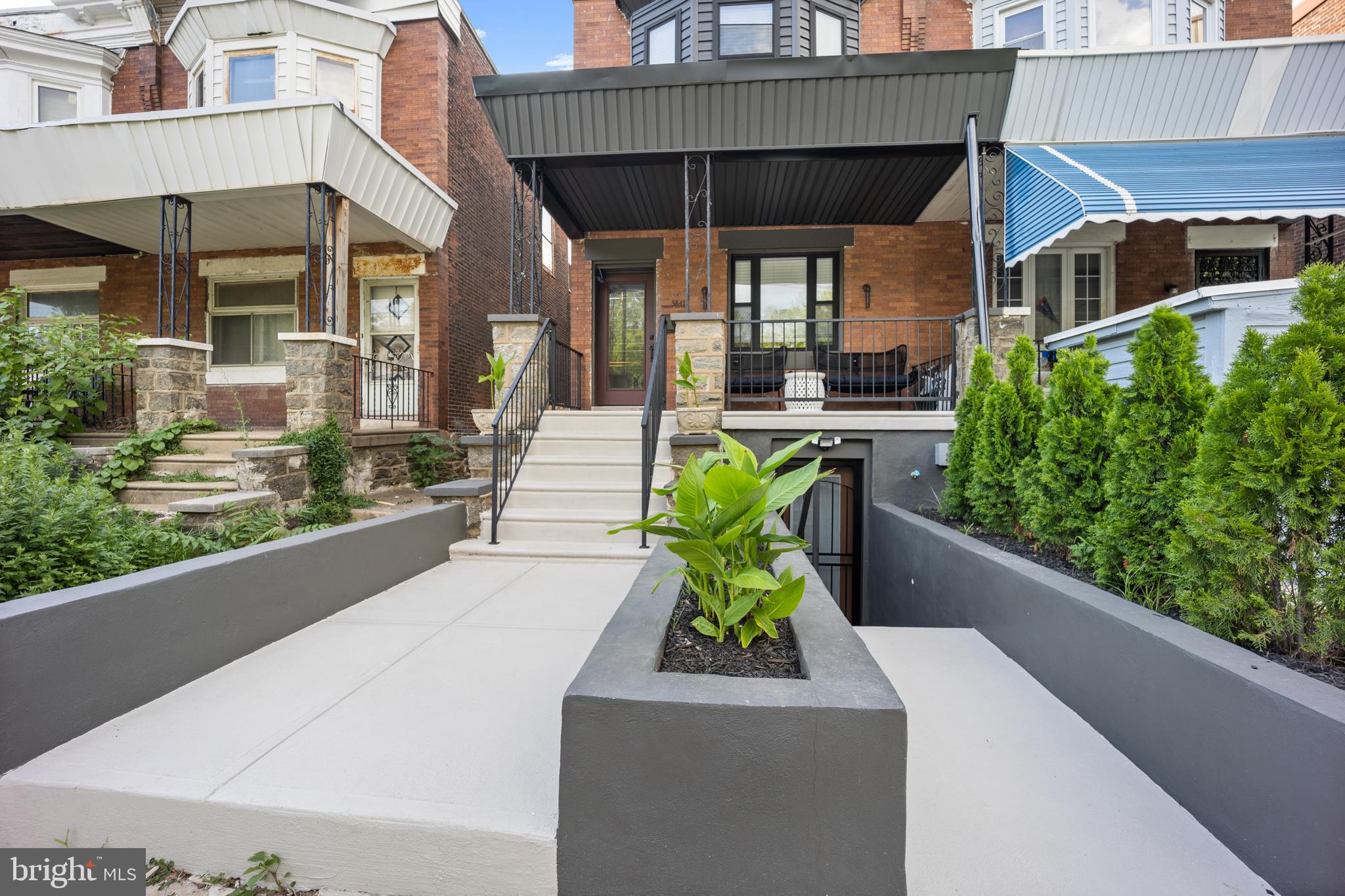 Welcome to 5841 Chester Ave. where Urban Convenience Meets Classic Charm-The Ideal Philadelphia Home for Professionals and Families!
This beautifully located Philadelphia home offers unbeatable access to Center City, University of Pennsylvania Hospital, CHOP, Jefferson, and the Fashion District. It’s the perfect location for doctors, lawyers, nurses, med students, professionals, and growing families seeking a convenient and connected lifestyle.
This spacious 5 bedroom home offers ample square feet of finished living space combining comfort, versatility and prime location. The main floor features a state-of-the-art kitchen that anchors the main living space. Chef-inspired features include a sleek downdraft vent cooktop, a smart stove with a built-in air fryer, a microwave oven drawer, a large-capacity side-by-side refrigerator and a center island that comfortably seats 10+ people. This home has an advanced smart lighting system that allows you to shift from bright and lively to dim and sultry with ease. The kitchen opens seamlessly into the living and dining areas, creating a flowing entertainer’s dream layout where guests can gather, relax, and enjoy both the front porch and backyard deck with ease. White-washed oak-toned flooring runs throughout, adding a sense of warmth and cohesion.
The upper level provides 3 generous sized bedrooms and 1 massive sized full bathroom. The bathroom is thoughtfully designed with a soaking tub, a custom vanity offering generous storage and a tunneled green tile shower surround that adds a rich, spa-like touch.
The fully finished lower level adds more square footage of private living space, including 2 bedrooms and 1.5 baths. The lower level functions as a private and fully equipped Accessory Dwelling Unit (ADU), often called a “mother-in-law suite,” featuring a dedicated front walkout entrance, 8-foot ceilings, exposed brick walls, its own washer and dryer, and a flexible layout ideal for guests, extended family or possible rental use. A previous appraisal identified this space as an ADU with the potential to be used for rental income.
Every level of the home, including the basement, features 8-foot ceilings and exposed brick accents for a stylish, comfortable feel.
Outside, the larger-than-average backyard and expansive deck are perfect for entertaining or enjoying quiet mornings, while the spacious front porch offers direct views of Francis J. Myers Recreation Center — a 7.6-acre park offering sports fields, a pool, basketball courts, a gym, computing center, and more. The center is currently undergoing a $5 million renovation to upgrade pools, courts, and landscaping, enhancing its appeal as a lively, family-friendly destination.
Key features include a spacious layout ideal for remote work, entertaining, or family living. Quick commute to hospitals, universities, and downtown Philadelphia. Close proximity to dining, shopping, and entertainment. The transit access is unbeatable, with the T3 trolley stop right outside the front door, providing direct service to 13th Street in Center City and the Darby Transportation Center, with a branch to the 65th Street Yard.
Located just 7 minutes from Bartram’s Garden, a 50-acre riverside park with trails, historic gardens, and the Sankofa Community Farm, this home offers the best of city living with green space and community life just moments away. Additional features include a wired EV charger that is already installed, just add your preferred port. Custom Versace handrails. All-new plumbing and heating, along with a ductless mini-split air system throughout.
Whether you’re planting roots or advancing your career, this home offers the best of both worlds: city energy at your doorstep with a welcoming neighborhood atmosphere. This is a must-see home. Don’t wait, schedule your private tour today and and discover why this isn’t just a home, its your next chapter.