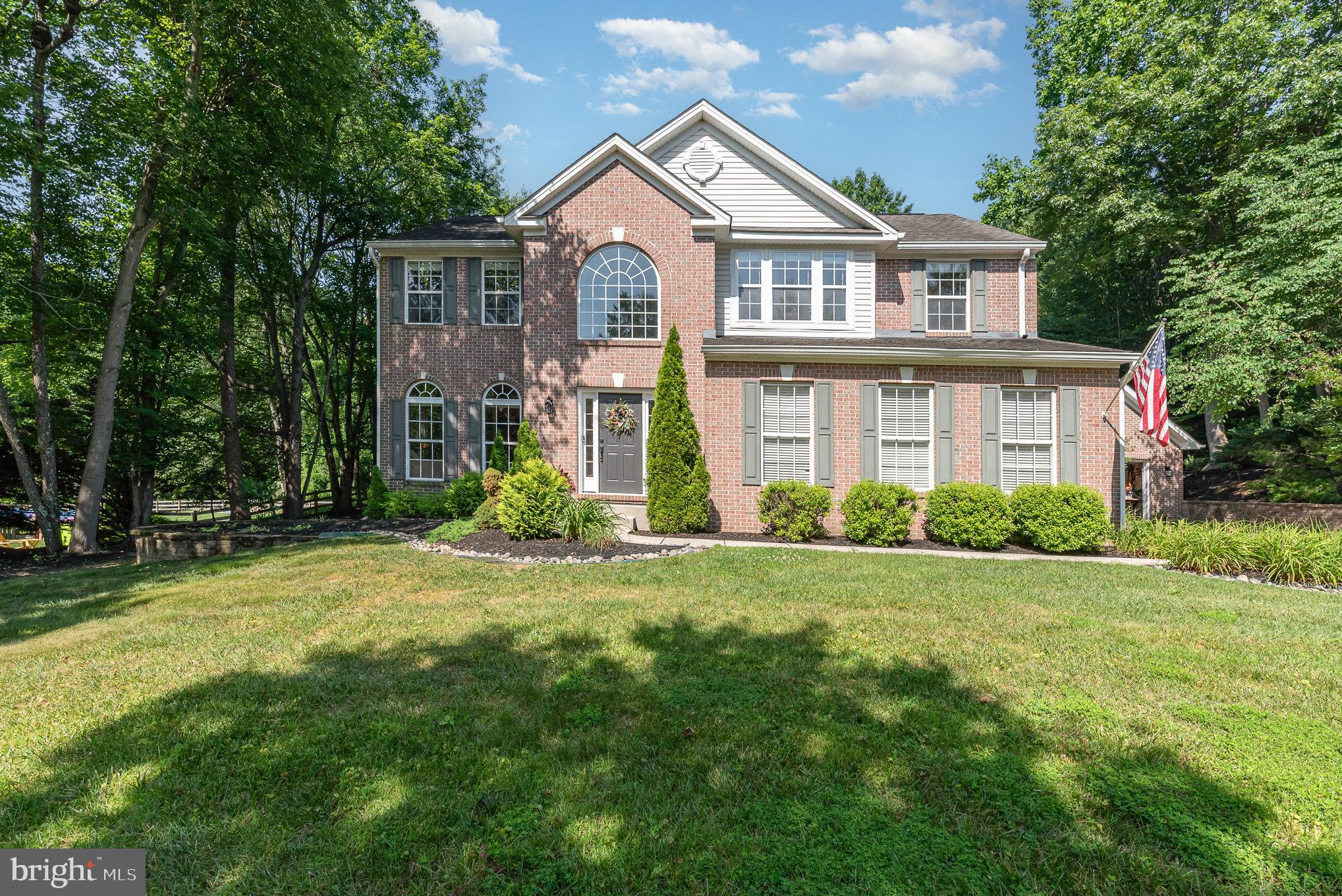 Welcome to this beautifully maintained 5-bedroom, 3.5-bathroom home nestled on a cul-de-sac and backing to serene woods, a nature trail, and land owned by the community college—ideal for privacy and peaceful views. Enjoy fishing at the Campus Hills Estates community lake just steps away! Inside, you’ll find thoughtful upgrades throughout: a stunning primary bath renovation (2019), updated upstairs bathrooms (2025), and brand-new HVAC (2025) and furnace (2022). The 2-story foyer leads to formal living and dining rooms with gleaming hardwood floors, crown and chair molding, and large windows that flood the space with natural light. The kitchen boasts granite counters, a center island, 42” cabinets, and stainless steel appliances, and opens to a spacious family room with a gas fireplace and sliders to the maintenance-free deck—perfect for entertaining. The main level includes a bedroom with hardwood floors, ideal for a home office, and a convenient laundry room. The finished lower level offers exceptional versatility with a second kitchen, full bath, rec room, theater room, and potential bedroom. Additional highlights include a cathedral-ceiling primary bedroom with a huge walk-in closet and updated en suite bath, an attached 2-car sideload garage plus a detached 1-car garage. This pet-free, smoke-free home combines comfort, functionality, and an unbeatable setting.