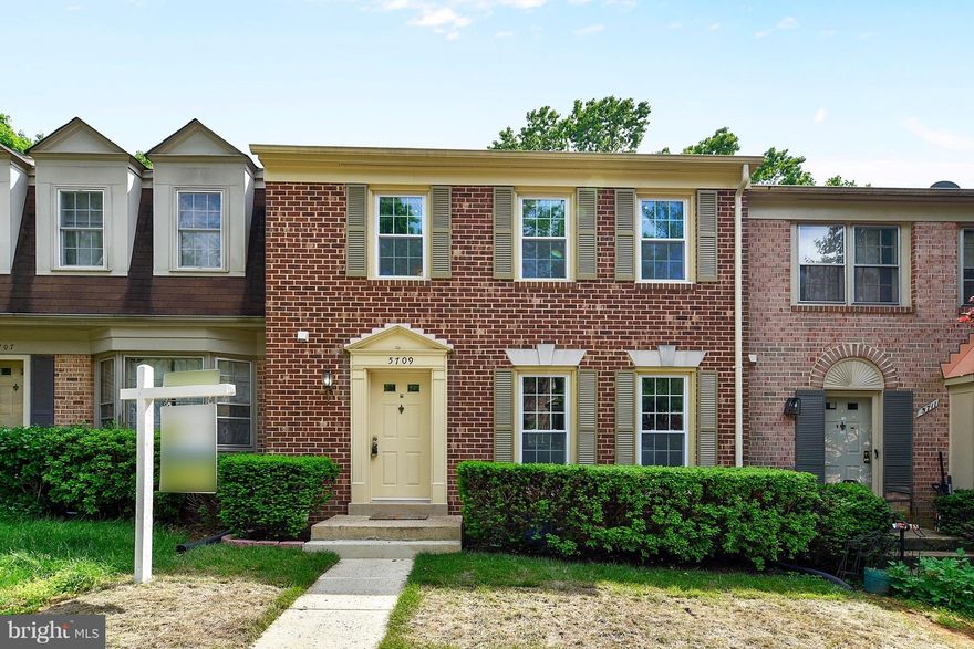 Beautifully Renovated Townhome! Designer kitchen w/ stainless steel appliances, granite counters & wood floors.  Large, flexible open floorplan...perfect for entertaining! Spacious master bedroom suite w/ spa-like bathroom w/ a walk-in shower. Walk out basement w/ wood burning fireplace. Newer windows, recessed lighting...too many upgrades to list!  Terrific School Pyramid and Ready to Move In!