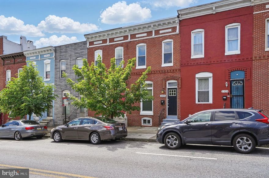 Welcome to this beautifully updated brick-front rowhome offering the perfect blend of charm, space, and convenience—plus private parking! Step inside to gleaming hardwood floors throughout the main level and an open, airy living room filled with natural light—perfect for entertaining. The spacious dining area flows seamlessly into the kitchen, which features granite countertops, stainless steel appliances, ample cabinetry, and an island for quick meals or casual gatherings. A full bathroom with a stand-alone shower and main-level laundry adds extra functionality and ease. Upstairs, the primary bedroom offers tray ceilings and a large closet, while a shared full bath with a relaxing tub/shower combo and two additional bedrooms provide plenty of space for family, guests, or a home office. Out back, enjoy the convenience of a private parking pad. Located just minutes from Johns Hopkins Hospital, Patterson Park, Canton, Fells Point, and downtown Baltimore—this home has it all!