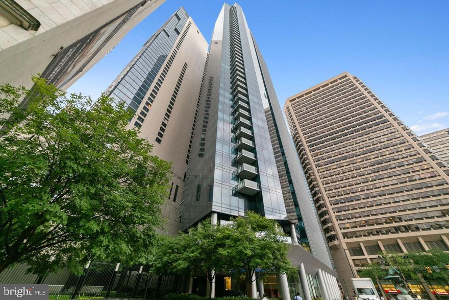 Welcome to Penthouse Unit 45A, a spectacular high-floor residence in the coveted Residences at The Ritz-Carlton, Philadelphia. One of only four units on this ultra-private, rarely available floor, this sun-drenched designer home combines iconic views, best-in-class amenities, ONE PARKING SPACE INCLUDED and true five-star service in the city’s most prestigious address. This 2-bedroom, 2-bathroom showpiece boasts SOARING 12 FOOT CEILINGS, wall-to-wall operable windows, and a sprawling open-concept layout with panoramic southeast, south, and west-facing views. Originally the building’s MODEL UNIT, it is beautifully furnished (negotiable) and features extensive upgrades, including CUSTOM CLOSETS, motorized blinds, bespoke designer grasscloth wallpaper and IMPRESSIVE VIEWS OF THE DELAWARE RIVER WATERFRONT. The gourmet chef’s kitchen includes Viking gas range, Sub-Zero refrigerator, Miele dishwasher and  Stone countertops, glass tile backsplash, Franke stainless steel undermount sink, and Dornbracht fixtures The master suite is a private retreat with morning sun and skyline views, complemented by a spa-like marble bath with: Calacatta marble finishes, frameless glass stall shower, Bain Ultra soaking tub, double vessel sinks, and Duravit commodes. Experience legendary service, unmatched style, and effortless luxury—only at the Residences at the Ritz unit 45A. A spacious second bedroom, equally refined, and a second full marble bathroom complete the layout. In-unit washer/dryer and ample storage provide daily convenience. 1 onsite valet parking space is included.BUILDING AMENITIES: Unrivaled amenities include: Chauffeur-driven Mercedes S550 and Towncar services, 24/7 valet parking, concierge, and doorman, Private landscaped park with 12' waterfall, State-of-the-art fitness center, lap pool, hot tub, and yoga studio, Luxurious residents’ lounge, media room with theater seating, and wraparound terrace.  Pet-friendly building with on-site dog run As a resident, you enjoy access to the Ritz-Carlton Hotel lobby and restaurant, with preferred rates for hotel spa, housekeeping, in-residence dining, and lounge services. LOCATION FEATURES: Located steps from Rittenhouse Square, The Kimmel Center, Academy of Music, and the best dining, shopping, and theaters in Center City. Easy access to 95/676/76, public transit and regional rail. This is truly the pinnacle of Philadelphia living.