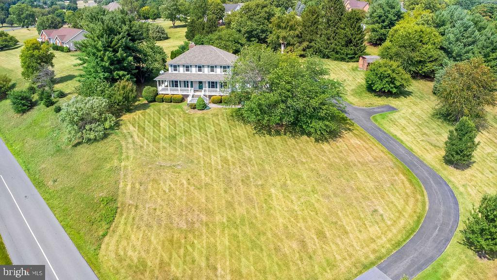 Massive price adjustment, and paint color updates on select rooms! Make your offer before it's gone! Welcome to 146 Horizon Way! This one of a kind custom pool home with a stunning view sits on a gorgeous maturely landscaped 2.23 acres. Did someone say outdoor bathhouse? You got it, this home features a full bathroom with an outdoor shower and changing area. The rear paver patio is already wired for a hot tub, has a heated pool, built in propane fire pit, hardscape lighting, koi fish pond, continuous waterfall, sun shade sails, and large pergola. The outdoor space has so much more to see....such as a tree house, you’ll just have to view for yourself. Some unique features of this 3 bed 2.5 bath home include a brand new propane heat pump, advanced water filtration system, new hot water tank, 50 amp hookup in the garage, central house vacuum system, hardwood flooring, and commercial grade washing machine. As you walk in the foyer, you’re greeted by a true colonial layout with the dining room to the right and living room to the left. The kitchen connects to the dining room, open to a breakfast nook framed with a beautiful bay picture window overlooking the fabulous pool area. The kitchen has a stove with double ovens, French door refrigerator, separate pantry, roll out window above the double bowl under mount sink, separate faucet for filtered water, recessed lighting, and a large island. Pass through the breakfast nook to the sitting room, with a brick mantled propane fireplace that could be converted back to wood if chosen. The laundry room with cabinetry is centrally located on the first floor connecting to a half bath. Upstairs, you’ll find a large bedroom with double closets to the right, a hall bathroom in middle, and the owners suite to the left. In between, sitting towards the front of the home is two closet bedroom with a built in storage cabinet Murphy bed. The owners suite features three closets, including a cedar lined closet and walk-in closet. The owner’s bathroom has a massive walk-in tiled shower with a seat, double shower heads, built in product nook, glass shower doors, double bowl vanity, and tile flooring. The basement is finished on one half with a recreation room, and separate room to use as one wishes. The unfinished portion of the basement creates a massive opportunity to have an organized storage space and open access to all technical needs of the home. This home is truly a special find; schedule your showing today to make 146 Horizon Way your next address!