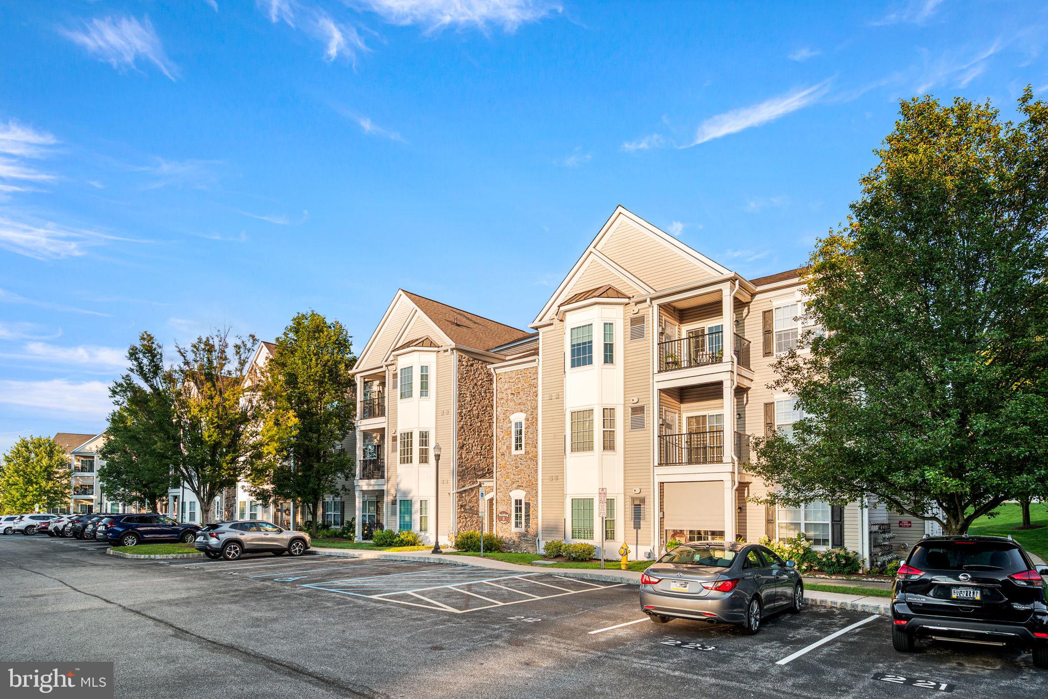 Welcome to Traditions at Ridley Creek, a coveted and established lifestyle community! This lovely 55+ condo has an assigned parking space in front of the building 2, #231, a storage cage in Bldg #9, a gorgeous clubhouse with a fitness room, library - game room, party room with cathedral ceilings, fireplace, full kitchen, and an outdoor covered patio area for entertaining. The condo is on the 3rd level with a private balcony. Entry through the security door into a wide hallway follow to the elevator that will ascend to the 3rd floor lobby.There are 4 condos per floor. The condo is painted T/O with neutral carpet in bedrooms and den. The condo has a double wide laundry closet offering convenience. The modern layout is open, the dining room has hardwood floors, chair rail and crown molding. The kitchen offers white appliances, garbage disposal, dishwasher, newer built in microwave, gas range, 42" cabinets and lots of counter space, natural sunlight filters into the condo for a bright and sunny home. The view from the balcony is perfect to relax and enjoy the beautiful sky during sunset. The main bedroom suite has newer neutral plush carpet, a bay window bump out, a large double wide closet, linen closet and a spacious full bath with tile flooring and a walk-in shower with bench. As you tour the condo you will find the 2nd bedroom with newer carpet, den with newer carpet, and a 2nd full bath with tub/shower. The location is convenient, Brookhaven Borough is a wonderful community with year-round activities for all ages to enjoy including a senior Holiday luncheon, several shopping centers, multiple eateries and grocery stores. Media Borough, Everybody's Hometown, is also very close-by and offers Dining Under the Stars May to September, street festivals , jazz walks, farmer's market, town fairs, and holiday parades in every season. Convenient to Phl Airport, sports and music venues, regional rail is near by. Choose a carefree lifestyle in a friendly, exceptional 55 + community!