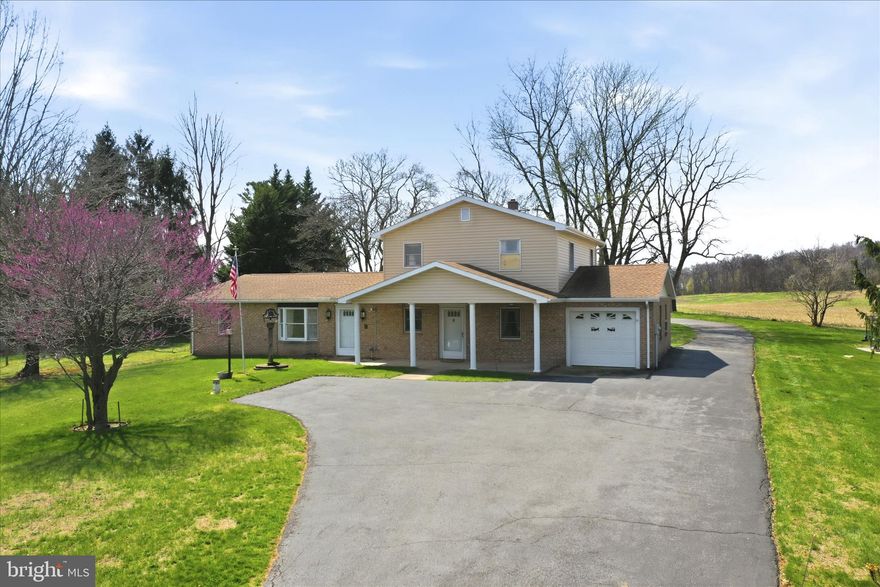 Discover the potential of this unique 3-bedroom 2-bath colonial home set on 1.36 scenic acres with beautiful pasture views. This property offers a versatile layout and plenty of space for multi-generational living or rental possibilities. 
Originally a rancher with a thoughtfully added second level, the main floor features a comfortable living room, galley kitchen, and separate dining area. The primary bedroom includes a walk-in closet and a dual-entry full bath that also serves the hallway. A second bedroom and convenient main-level laundry.
Upstairs, you’ll find a fully functional in-law suite complete with its own kitchen, living room, full bath, and private bedroom—ideal for extended family, guests, or additional income potential. 
The exterior offers exceptional utility and storage, including an attached 1-car garage, a spacious driveway with ample parking, a storage shed, and an impressive detached 2-car garage large enough to accommodate an RV. 
Major updates include a heat pump and roof, both installed in 2018,  all new vinyl siding, and a new water softener installed in 2022. Enjoy rural living while still being within reach of everyday conveniences.  Property is being sold as-is.
A rare opportunity to own a property with space, flexibility, and incredible potential—bring your vision and make it your own! Schedule your showing today!