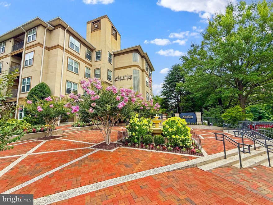 INCREDIBLE PRICE for this  updated top floor 2 bedroom 2 bath condo in North Bethesda with 1,056 SQFT featuring an open floor plan with a FULL SIZE in-unit washer and dryer and your own rarely available spacious PRIVATE GARAGE  parking space (#17) providing additional storage.  Features a gourmet kitchen including granite counter-tops, tall and deep cherry cabinets, and stainless-steel appliances with a gas stove. 2 spacious bedrooms on opposite sides with brand new  wall-to-wall carpeting and 2 walk-in closets.  Large updated bathrooms with brand new hardware.   Beautiful wood floors in the main living area. Enjoy your morning coffee on your private balcony.   Newer systems installed in 2021 including HVAC unit, hot water heater, washer & dryer, garbage disposal and more.  Just freshly painted.  Dogs and cats are allowed.  FHA and VA Approved.  White Flint Station by Toll Brothers is an amenity-rich community including a 24-hour fitness center, beautiful outdoor pool with a hot tub spa, two tier party room with a gas fire place, billiard table, coffee bar, courtyard barbeques, meeting rooms and very helpful on-site managers and concierge desk.  Choice of either Verizon or Xfinity for your cable provide.  Close to North Bethesda Metro, restaurants and shops at Pike and Rose and all of your grocery stores to choose from including Trader Joes, Super Giant, Whole Foods and the new Wegmans.   Ideal for primary buyer or investor.  A Must See!