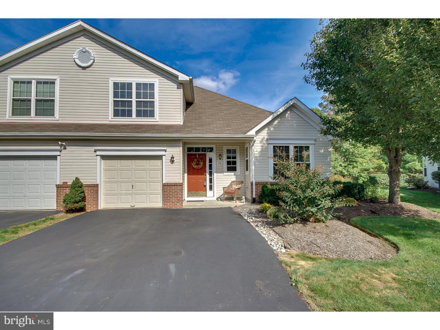 Welcome to the desireable Community of Flowers Mill. This gorgeous Twin features a spacious 2 story floor plan and many upgrades to the original model. Upon entering notice the two story foyer, beautiful turned staircase, gleaming cherry hardwood floors and extensive architectural trim. The kitchen features a sunny breakfast area, abundant cabinetry, large center island with additional storage and corian counters. This Curtis model is designed for first floor living at it's best featuring a first floor master & bath and vaulted ceiling in the spacious Great room, laundry & powder room. Another upgrade to this property is the Sunroom which leads to the sunny patio. The second floor features the second bedroom & another full bath and additional storage area. The association fee includes grass cutting, mulching, snow removal including driveways and roof replacement. The Clubhouse features a state of the art fitness center, indoor pool and sauna. There is also a library, computer room, billiards room, and much more. Outdoor amenities include tennis & bocce ball courts, a putting green, outdoor pool and picturesque hiking/biking trails. Conveniently located within walking distance to Flowers Mill shopping center and minutes to Septa train station.