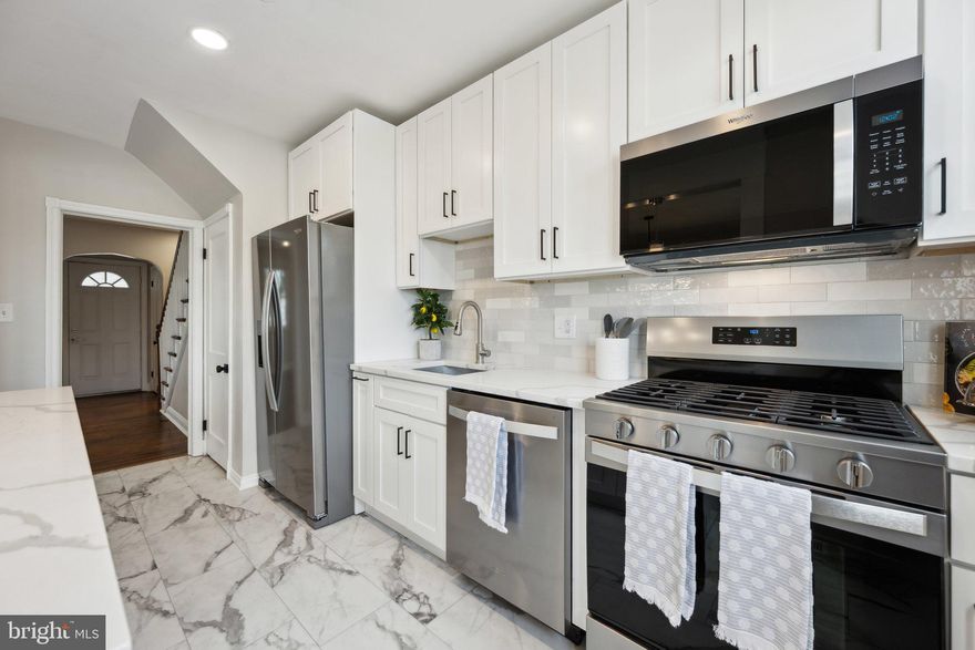 This newly rehabbed 3-bedroom, 2-bath townhouse seamlessly blends modern upgrades with its original charm. Located just minutes from downtown Baltimore, this home offers easy access to Clifton Park Golf Course, Lake Montebello, and Johns Hopkins Hospital.  Featuring original hardwood floors throughout, this home boasts an open-concept kitchen with a large peninsula, quartz countertops, soft-close cabinets, and stainless steel appliances. The finished basement includes a bonus room, perfect for a home office or additional living space, along with extra storage and a washer and dryer. A brand-new HVAC system with air conditioning and a new water heater add to the home's modern conveniences. The spacious backyard provides the perfect setting for outdoor enjoyment.  Situated in the historic Belair-Edison area, this home is just a short drive from Herring Run Park, the Maryland Institute College of Art (MICA), and Baltimore’s Inner Harbor. With convenient access to major commuter routes, public transportation, and local dining and shopping, this home is move-in ready. Schedule your showing today.