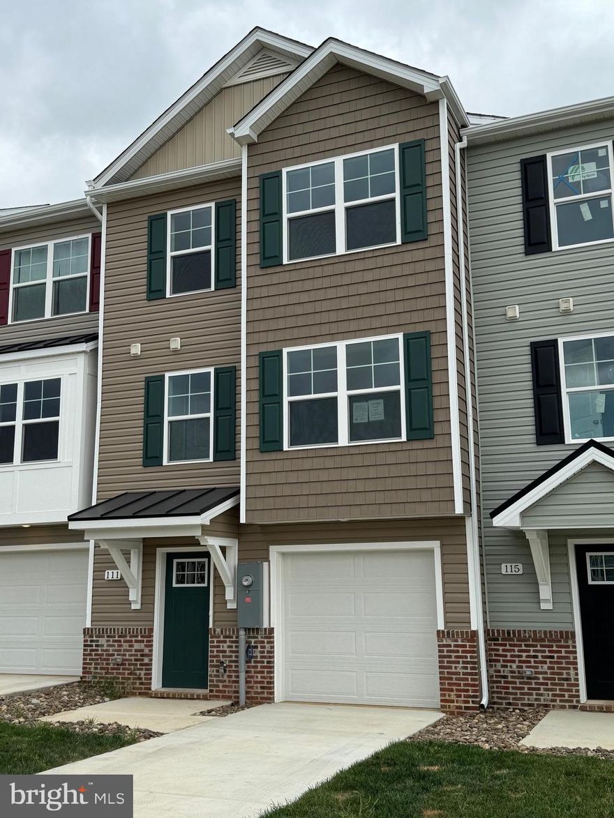 New Town Homes under construction in The Communities of Burwell featuring 1935 sqft of living space. Home has bump outs in main level family room and upper level secondary bedroom, spacious open floor plan, 4 bedrooms/ 3.5 baths, Kitchen with granite countertops, separate island and island bar to family room, stainless steel appliances, and luxury vinyl plank flooring throughout the main level. The upper level primary bedroom has vaulted ceilings, walk in closet, and full bath with tile shower and glass door. The lower level offers 4th bedroom and full bath. Exterior brick on front, 1-car garage with auto opener, and concrete driveway included. **interior photos are similar construction**