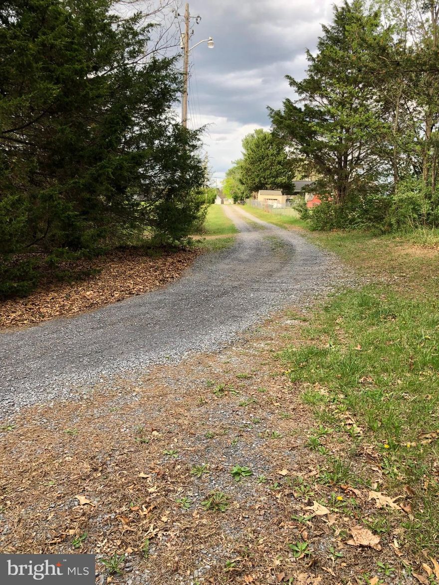 Build your dream home on this beautiful 5-acre wooded lot on Nadenbousch Ln., Inwood, WV. This buildable parcel offers privacy, natural surroundings, and the convenience of public water and sewer hook-ups available (cost to obtain) — a rare opportunity for land in this desirable area. Perfect for a custom home, weekend retreat, or investment property, this lot provides a peaceful setting while still being close to everything. Located in Berkeley County, this property offers easy access to Interstate 81, making commuting simple to Martinsburg, Winchester, and Hagerstown. Enjoy nearby shopping, dining, and entertainment, plus outdoor recreation at the Potomac River, Sleepy Creek Wildlife Management Area, and Poor House Farm Park. All sizes are approximate.