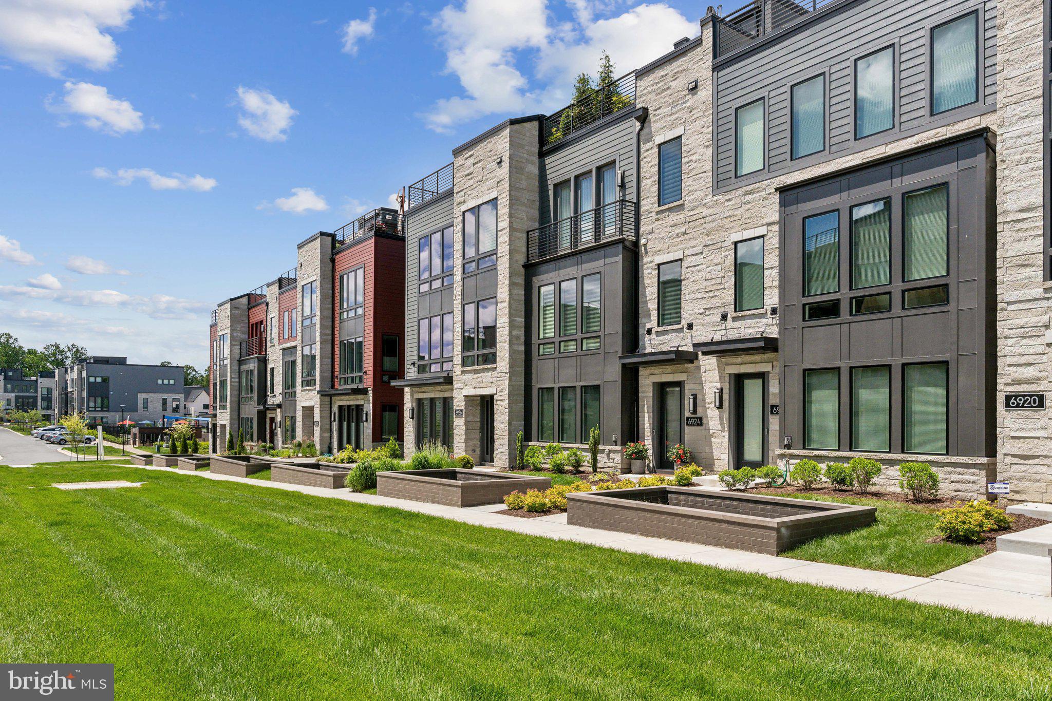 Welcome to the only townhouse currently available in Amalyn! Better than new 3-level Camelia model townhouse with ELEVATOR and roof deck. Open concept “On the Green” home, upgraded and customized throughout. 3/4 bedrooms, 3.5 baths. Every top-of the line option was chosen when built, including hardwoods throughout, upgraded kitchen cabinets and appliances, gas fireplace in living room, state of the art smart home technology, full bath on entry level, high-end tiled bathrooms, plumbing fixtures, and shower doors. Spacious tiled balcony off the main level is perfect for BBQ’s. Tiled roof deck provides further generous outdoor living space. Custom designer finishes include porcelain wall and woodwork in entry level media room/office/possible 4th bedroom, living room Porcelanosa tiled fireplace wall with built-in’s, imported lighting fixtures in stairway hall, dining room, kitchen, and powder room. Every closet has been customized. Power window treatments in living room, powder room, and primary bedroom. Dressing table added in family bath. No detail left undone. Amalyn is a popular new Bethesda community with walking trails and nature paths, park, pool, kiddie splashpad, and fabulous clubhouse featuring a gym, lounge, clubroom and bar.