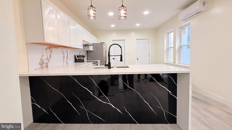 Imagine walking up to 527 Beech St, a home that perfectly captures that "new house" feeling without the new-build price tag. From the moment you pull into your private driveway with enough space for four vehicles the stress of street parking simply disappears.

As you step inside, your eyes are immediately drawn to the heart of the home: a kitchen that belongs on the cover of a magazine. You’ll find yourself running your hand over the stunning Level 4 Quartz waterfall countertops, picturing where the coffee maker will go and imagining friends gathered around the brand-new stainless steel appliances while you entertain under the soft glow of recessed lighting.

But the real beauty of this home is what you don’t see. We’ve taken the worry out of homeownership by replacing the essentials with the best materials available. You can sleep soundly under a brand-new roof, knowing the plumbing has been upgraded to Copper and Pex piping and new electrical  through the entire home.... the gold standard for peace of mind.

Whether it's the peak of summer or a chilly winter night, you’ll stay perfectly cozy. Every single bedroom features its own independent Mini-Split unit, allowing everyone in the house to set their own "just right" temperature while keeping your energy bills surprisingly low. From the crisp new walls with updated insulation to the waterproof flooring that flows beautifully through every room, every inch of this space has been designed to be "life-proof."

After a long day, you can retreat to one of the two massive, elegantly designed full bathrooms—one on each floor for ultimate convenience. Or, if the weather is nice, head out to the expansive backyard, a blank canvas ready for your first summer BBQ or outdoor celebration.

Best of all? You’re just two minutes from the energy of downtown, with local restaurants and nightlife right at your fingertips. At 527 Beech St, there are no "to-do" lists or weekend repair projects. All the hard work is finished. The only thing left to do is turn the key, unpack your boxes, and start living.

Your fresh start is waiting. Schedule your tour today!