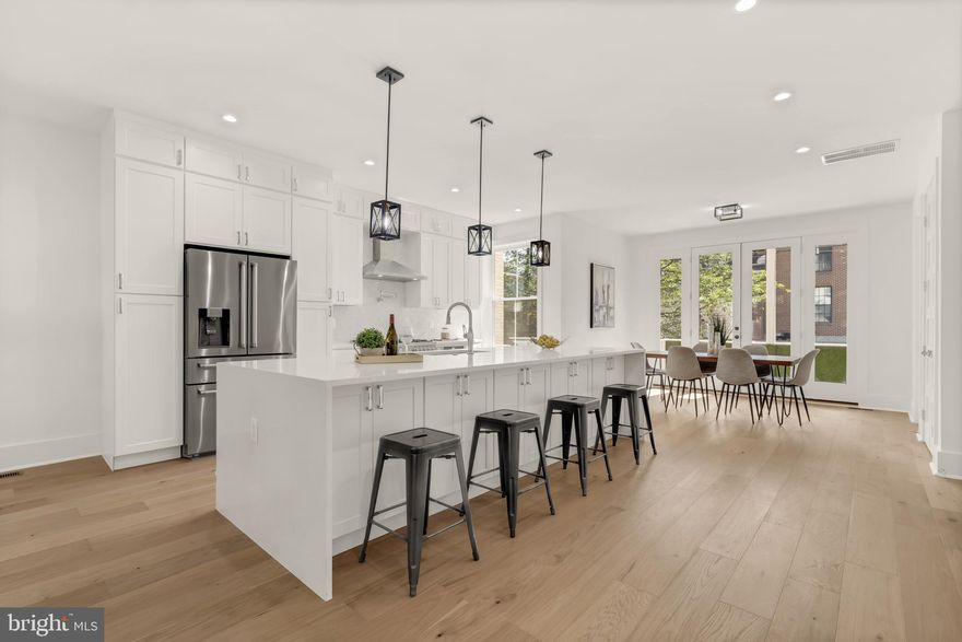 Welcome to the crown jewel of Woodley Park. This Wardman style, extra wide townhome has been reimagined for today's distinguished buyer's taste and is ready for you to call it home. At nearly 4,000 square feet, 2618 Woodley Place is the perfect destination for you to spread out and enjoy city living, without sacrificing space. 

Upon entry, enjoy open concept living with an abundance of natural light flooding this 24+ foot wide home throughout the entire main level. The kitchen is equipped with a Bertazzoni Italian appliance package, expansive quartz waterfall kitchen island with seating for 5 and flows directly to the dining area which opens to private parking (with roll up garage), rear deck, and fenced in patio area. On the first upper level, one large en suite bedroom with its own walk in closet and the first owner's suite bedroom with 2 walk in closets and fantastically designed owners suite bathroom. Additionally, a study that incorporates an additional closet, which could be used as a bedroom or perfect home office,  with a rear porch over looking the backyard. With the laundry closet also being on this level, this level of the home is phenomenal.One the second upper level, bedroom suite three includes a walk in closet as well as a rear deck for an early morning coffee or enjoying the fresh air that the morning brings. This bedroom also includes its own large bathroom with double vanity. The second owner's suite in the front of the home on this level, also with two walk in closets, give the owners an additional option of where they want to lay their heads. In the English basement, this space is fitted to allow for plenty of flexibility. The owner's can use this as a separate living quarters for guests, an additional living space for them, or potential (with proper permitting) a rental unit to subsidize the mortgage. This additional living space brings tremendous value to a discerning buyer!

With completely remodeled systems, wide plank hardwood flooring, Impeccable design, convenient location, with expansive living, 2618 Woodley is truly a one of a kind home in Woodley Park...