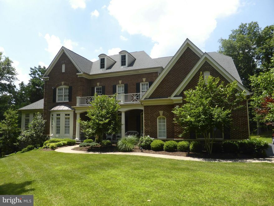 Custom Brick & Stone Waterfront Colonial on 2.34 Acres of Privacy, Granite Counters in Kitchen & Baths, Hardwood Floors on ML, Two Sunrooms, Plantation Shutters, 2 Brick FP gas fueled, Coffered Ceiling in Fam Rm, Large Deck, Veranda off MBR & Stone Front Porch, In-ground Sprinkler System, Security System, Sound System throughout interior, Deck & Veranda, Custom Wet Bar,Back-up Generator & MORE!