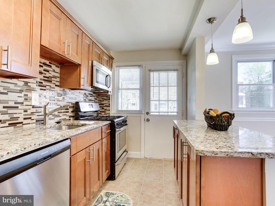 Total beauty! Renovated 3bd 2ba End-Unit Townhome, Flooded with Natural Light & Quality Upgrades throughout. Open Gourmet Kitchen w/ Breakfast Bar, Stainless Appliances, Granite Countertops. Beautiful Hardwood Floors throughout, Finished Basement with a Full Bath & Laundry area. Enjoy time with family & friends in your Fenced-In Backyard, Rear & Front Porches. This can be yours! Call To View now!