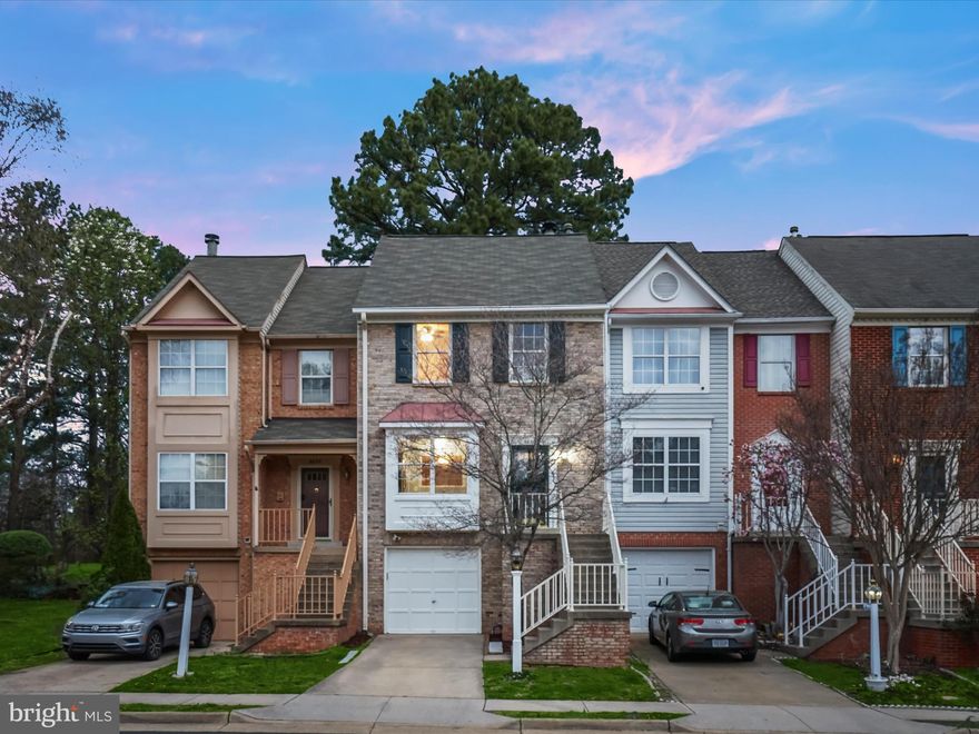 Charming Brick-Front Townhome in an Ideal Location!

Welcome to this stunning garage townhome located in the heart of Manassas! Perfectly positioned just minutes from the Historic Old Town, you'll enjoy easy access to an array of restaurants, shops, and vibrant local attractions. Plus, with the VRE train station only one mile away, commuting couldn't be more convenient.
     Nestled in a lovely neighborhood surrounded by lush common areas, mature trees, and a gazebo, this home offers the perfect balance of comfort and tranquility. Step inside to discover a beautifully refreshed interior, complete with new carpet, a brand-new kitchen floor, and fresh paint throughout. The spacious three-level layout features three bedrooms, two full baths, and two half baths, providing ample space for both relaxation and entertainment.
     The main level welcomes you with an inviting eat-in kitchen, a dedicated dining area, and a cozy living room that seamlessly flows to a large backyard deck — perfect for outdoor living and hosting gatherings. The fenced-in rear yard adds an extra layer of privacy, making it a peaceful retreat.
     The primary suite is a true sanctuary, offering an ensuite bath with a spacious shower and two sinks, a linen closet, and a private "deck for two" that overlooks serene wooded views — a perfect spot to unwind. The lower level provides a flexible space with a cozy fireplace, ideal for relaxing or entertaining guests.
-Additional features include a one car garage, driveway, and two assigned parking spaces (#20). This charming townhome is an opportunity you won't want to miss!