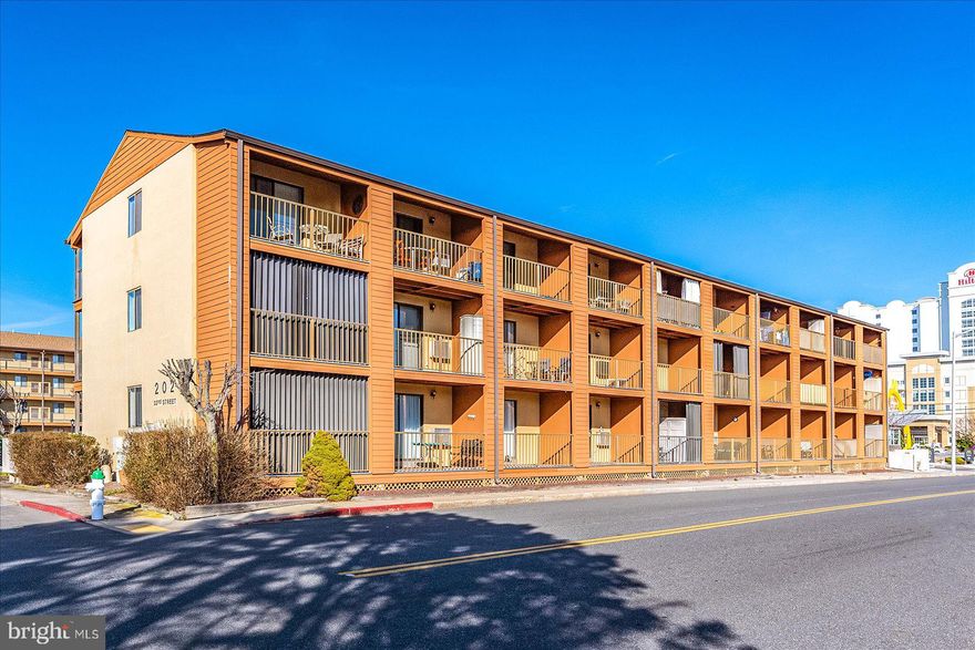 SELLER OFFERING $2,500 TOWARDS BUYERS CLOSING COSTS! Affordable luxury top floor studio end unit now available only two blocks from the beach! This fully renovated condo in the heartbeat of midtown attractions is close to so many of OC's finest, Jolly Rogers Amusement/Water Park, Coconuts Beach Bar, OC Wasabi, Anthonys Deli & Barn 34 to name a few! So many lovely touches here including; all solid wood kitchen cabinets/closet doors/Murphy Bed/California Closet organizer, stylish Quartz countertops, SS GE appliances, COREtex luxury vinyl plank flooring, gorgeous tile shower, loads of storage, high end furnishings, TWO sleek Samsung TV's posing as artwork for both couch & bed entertainment, washer/dryer, a/c/heat combo wall unit which is WIFI enabled, cable w/ HBO included in fees (even cable modem conveys), built in USB ports throughout, peeks of ocean from balcony & bay from extra end unit kitchen window, perfect covered balcony with views of water park for fun people watching however incredibly peaceful in shoulder months. This really could be the one you've been waiting for. New blaconies & stairwells