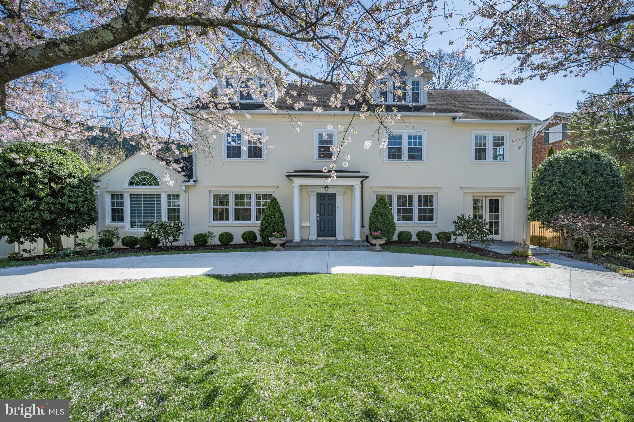 This elegant, fully renovated 5-bedroom, 4.5-bath colonial with circular driveway is set on a serene, cherry blossom-lined one-way street in the heart of Kenwood. This highly sought-after location offers easy access to downtown Bethesda, Little Falls Parkway, and the Capital Crescent Trail. Just minutes from the Metro, Kenwood Country Club, and within walking distance to public transportation and Whole Foods. This property sits on a spacious .41-acre lot with a prime south-facing orientation, filling every room with natural sunlight throughout the day. The main level features a stunning family room addition with vaulted ceilings, a fireplace, and picture windows that overlook the lush green side yard. It seamlessly connects to a brand-new kitchen with white cabinetry, quartz countertops, and stainless steel appliances. The formal living room exudes elegance, with a fireplace and French doors leading to the deck, offering views of the backyard. The inviting dining room boasts picture windows with beautiful views of the cherry blossoms in the front yard. A conveniently located powder room is off the foyer. The second level features 4 bedrooms, 2 full baths, and a den. The primary bedroom includes a sitting room and a walk-in closet. The third level offers a second primary suite with an all-marble bathroom, complete with a Jacuzzi tub, and a large walk-in closet. The lower level is fully finished with direct access to the backyard. It includes a spacious recreation room with natural light, a full bathroom, and a laundry/storage room. There’s also a former one-car garage that was converted into a storage room, which could easily be converted back. Enjoy this gorgeous home with a beautifully landscaped and fully fenced yard, located in a private and tranquil setting!