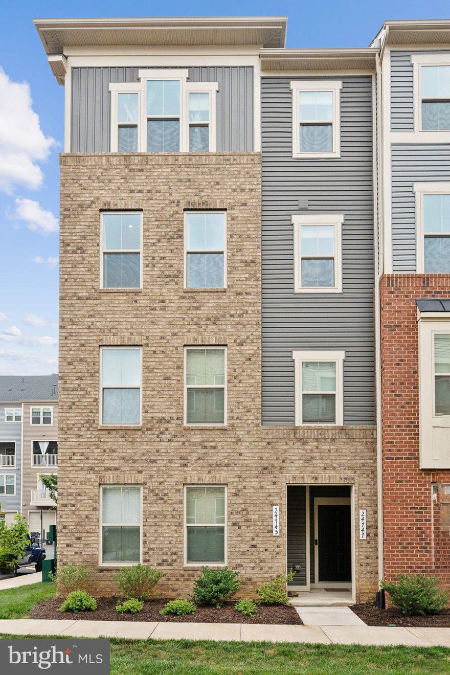 Welcome to your dream home in the highly sought-after Arcola Town Center! This immaculate end-unit townhome-styled condo, built in 2021, blends modern design, luxury upgrades, and everyday functionality across 2,484 square feet, offering 3 spacious bedrooms and 2.5 beautifully appointed bathrooms. From the moment you step inside, you're greeted by a thoughtfully designed layout that maximizes space, comfort, and natural light.

The main level features a stunning open-concept living space with luxury vinyl plank flooring, recessed lighting, and expansive windows. At the heart of the home, a meticulously upgraded chef's kitchen showcases top-of-the-line stainless steel appliances, double wall ovens, quartz countertops, a massive island with seating, a breakfast bar, ample cabinet storage, and pantry. The kitchen flows seamlessly into the elegant family room, perfect for both entertaining and relaxing.

Step outside to the covered sky lanai, an outdoor retreat —ideal for evening lounging or watching your favorite shows al fresco. Additional highlights on the main level include a convenient powder room.

Upstairs, the primary suite is a private haven featuring a generous sitting area, two walk-in closets, and a luxurious en-suite bath with dual vanities and an oversized double shower with bench seating. The upper level also features a convenient laundry room with a front-loading washer and dryer, as well as built-in cabinetry, making laundry a breeze. Two additional bedrooms offer spacious layouts, large windows that bring in natural light, and generous closets. A full hall bath with double sinks and modern finishes serves the secondary rooms.

Additional features include a one-car garage with private driveway and the benefits of being an end unit, providing additional privacy and windows throughout. This home also includes modern safety features like a full sprinkler system and smoke detectors throughout.

Nestled in a walkable neighborhood zoned to top-rated Loudoun County schools, Arcola Town Center offers outstanding amenities including a community pool, dog park, playgrounds, walking paths, and more. The community provides exterior maintenance, lawn care, snow removal, trash service, and water as part of the monthly association fee. Arcola Shopping Center is conveniently located within walking distance, featuring Walmart Supercenter, Wegmans, and numerous restaurants at nearby Dulles Landing.

The location offers excellent commuter access with Route 50, providing direct connections to Route 28, Route 267, and I-66, the Silver Line Metro station. Enjoy quick access to major commuter routes, Dulles Airport, the Dulles Tech Corridor, Tyson's, and Washington, D.C. The property is served by highly-rated Loudoun County schools, including Elaine E. Thompson Elementary, Stone Hill Middle School, and Rock Ridge High School. This is your opportunity to own a practically new home where upscale finishes, prime location, and low-maintenance living come together to create something truly special.