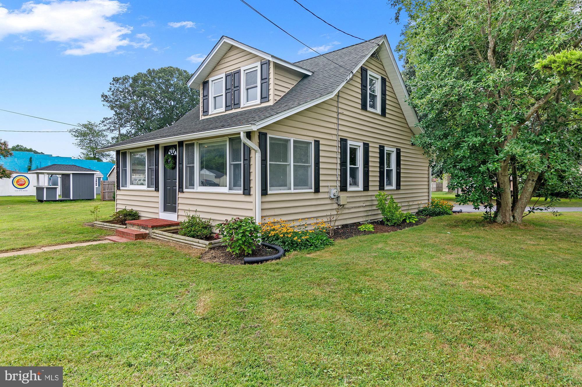 Picture-perfect Cape Cod home on a spacious lot in the heart of Deale! This lovingly updated and well-maintained home features a fully renovated bathroom, a kitchen with butcher block counters and new appliances, along with recent upgrades including a new roof, siding, gutters, oil tank, driveway, refinished hardwood floors, and fresh paint. Enjoy plenty of space, including a bright and airy sunroom/game room, complete with an extra refrigerator. The beautiful kitchen boasts a center island, while the large living room showcases stunning hardwood floors. The enclosed front porch adds extra living space and offers lovely views. A large main-floor bedroom offers the potential to easily convert into two separate rooms. The enormous primary suite spans the entire second floor, providing a private retreat. Set on a rare and level half-acre lot, this home also includes a shed and ample parking. Located in the charming waterfront community of Deale, this is an exceptional opportunity!