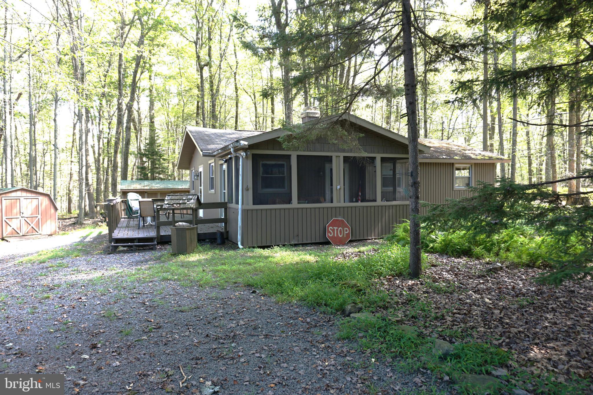 Get Ready for Your Perfect Pocono Retreat! Whether you're looking for a cozy starter home or a relaxing vacation getaway, this charming 3-bedroom, 1-bath home has all the warmth and character you need. An oldie but goodie, this inviting retreat features a fireplace to keep you warm on those crisp Pocono nights. Located in the desirable Locust Lake Village in Pocono Lake, PA, this home offers access to a wide range of amenities including: Beautiful lakes for swimming, fishing, and kayaking, tennis courts, community garden, community chalet and snow hill for winter fun, Year-round community events and activities. This home is your ideal introduction to life in the Poconos—whether for full-time living, a vacation retreat, or a short-term rental investment. Locust Lake Village is short-term rental friendly, making this a perfect opportunity to own in the heart of the Poconos and be close to all the region's attractions—skiing, hiking, water parks, dining, and more! Don't miss your chance to make this Pocono gem your own!