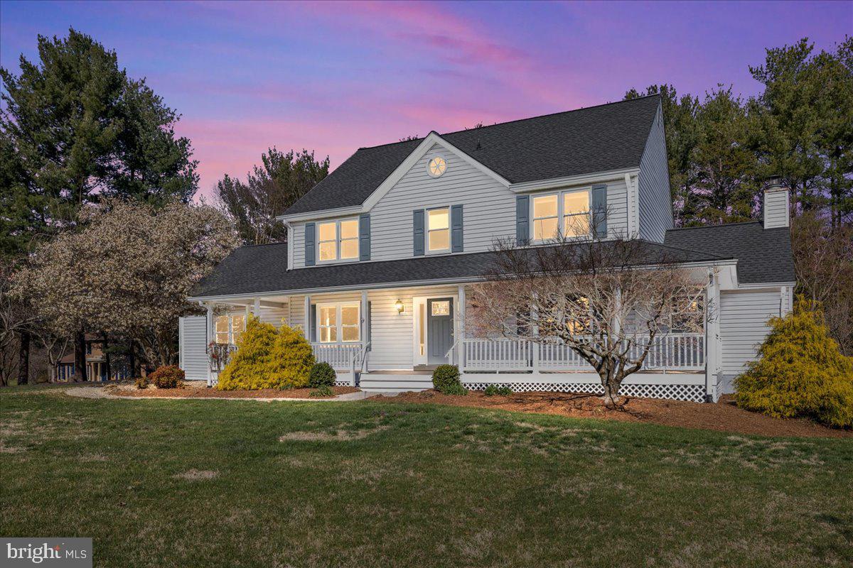 Tucked into the sought-after Kings Retreat community, this refined estate home blends classic craftsmanship with thoughtful updates on a generous 2-acre lot. Here, you’ll find style and substance in a setting that’s hard to beat. From the moment you arrive, you’ll be charmed by the curb appeal—sweeping driveway, rocking chair front porch, mature landscaping, and timeless style.
Enviable outdoor living spaces include a rear terrace and a window-wrapped screened porch with multiple skylights, flooding the space with natural light. Inside, an open-concept gathering area sets the scene for cozy relaxation or lively entertaining, anchored by a statement fireplace and detailed with custom millwork. The fully renovated kitchen is designed for both everyday living and elevated hosting, featuring custom cabinetry, granite countertops, a tile backsplash, high-end stainless appliances, an expansive center island, and a separate seated bar for casual dining. A built-in sideboard and cabinetry elevate the adjacent informal dining area, while a dedicated household desk station adds function without sacrificing flow. Tucked beside the kitchen, a hardworking servery features a second fridge, freezer chest, a walk-in pantry, and even a pet washing station—every detail has been carefully considered.
The lower level extends the home’s living space with a rec room, full bath, bar, and walk-out access. Upstairs, the primary suite is a true retreat with an en suite bath, laundry, three closets, and a spacious, versatile room—perfect for a private home office, yoga space, and more. The additional bedrooms are generously sized, offering comfort and flexibility, while the beautifully updated hall bath provides both style and convenience. A dual-bay side-load garage provides ample room for vehicles and storage.
Beyond the home, the location is unbeatable. Homestead Gardens—less than a mile away—offers a rich blend of gardening products, educational events, seasonal celebrations, and a charming venue for special occasions, making it a vibrant hub for the community. Commuters will appreciate the easy access to Route 50, providing quick connections to Annapolis (20 minutes), Washington, D.C., Baltimore, and major airports, including BWI and Reagan National (30 minutes). Fort Meade is also just 30 minutes away.
This home represents a rare opportunity to own a property that perfectly balances luxury, convenience, and tranquility in one of Davidsonville’s most desirable neighborhoods.