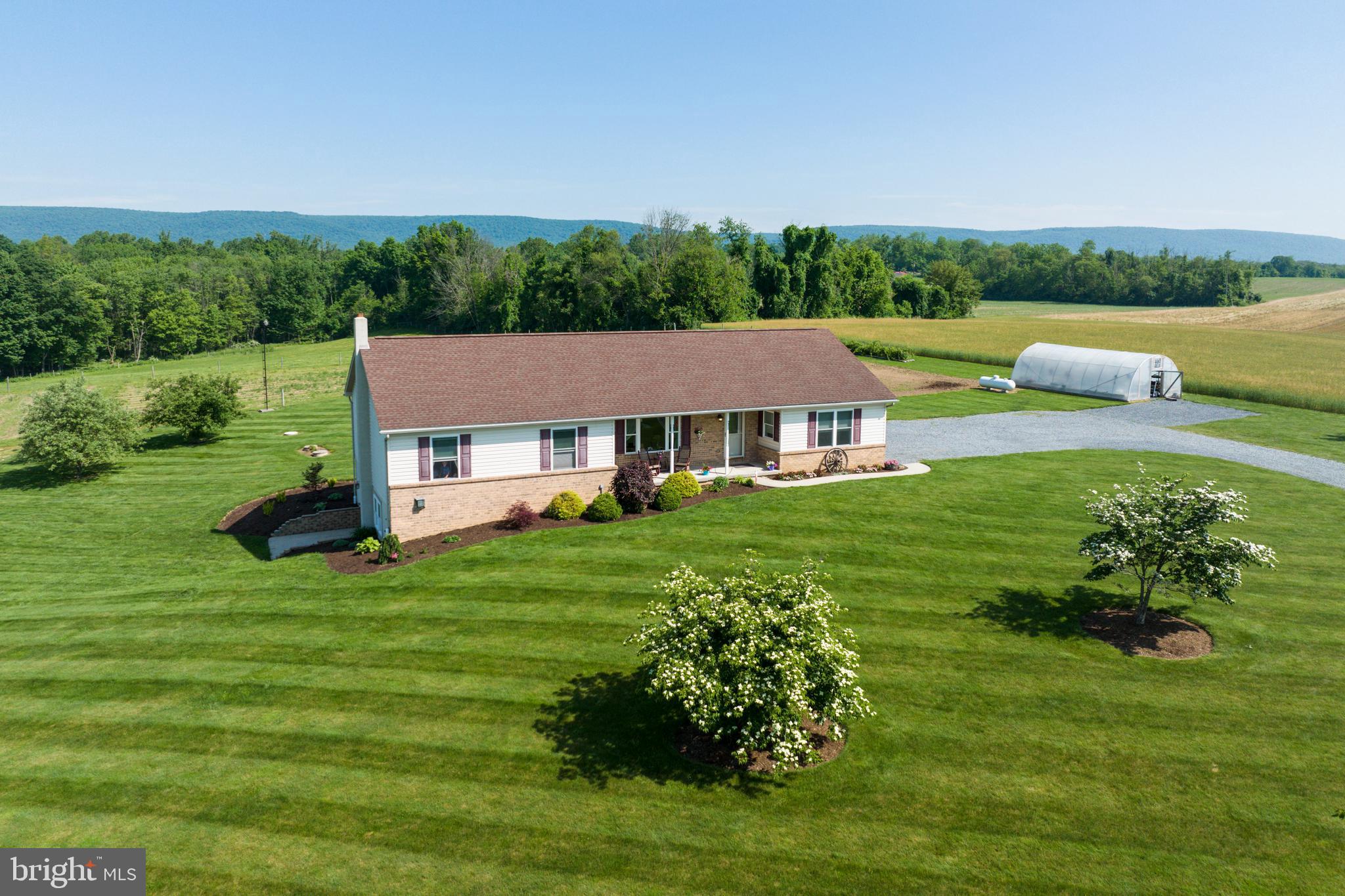 Desirable Farm (2 Separate Deeds: 22.3 Acers plus 31.1 Acre Tract) selling as one (53.4 Acres). Ranch House built 2007 in Move-in Condition. Over 3,600 SF Finished Area. Out Bldgs: Remodeled Bank Barn 36x60 w/ 2 Large Shop Bays w/ 20' ceilings PLUS 2 Small bays on lower level, and refinished upper level. Run-in Steer Pen w/ overhead door, insulated ceiling and feed storage. Insulated Dog Kennel 8x12 w/ heater and 3 dog runs. Mini Barn/Storage Bldg 12x20 – finished with electric. Green House 18 x 32 w/electric & water. Run-in Shed 17x18 on 31.1 Acre Tract across the road. Great location. Minutes off Rt 183 and 78/22. Ideal farm w/ pond and Northkill Creek boundary. Great farm for cattle, horses, vegetable/produce truck farming or potential poultry bldg site. " A MUST SEE" property to appreciate!