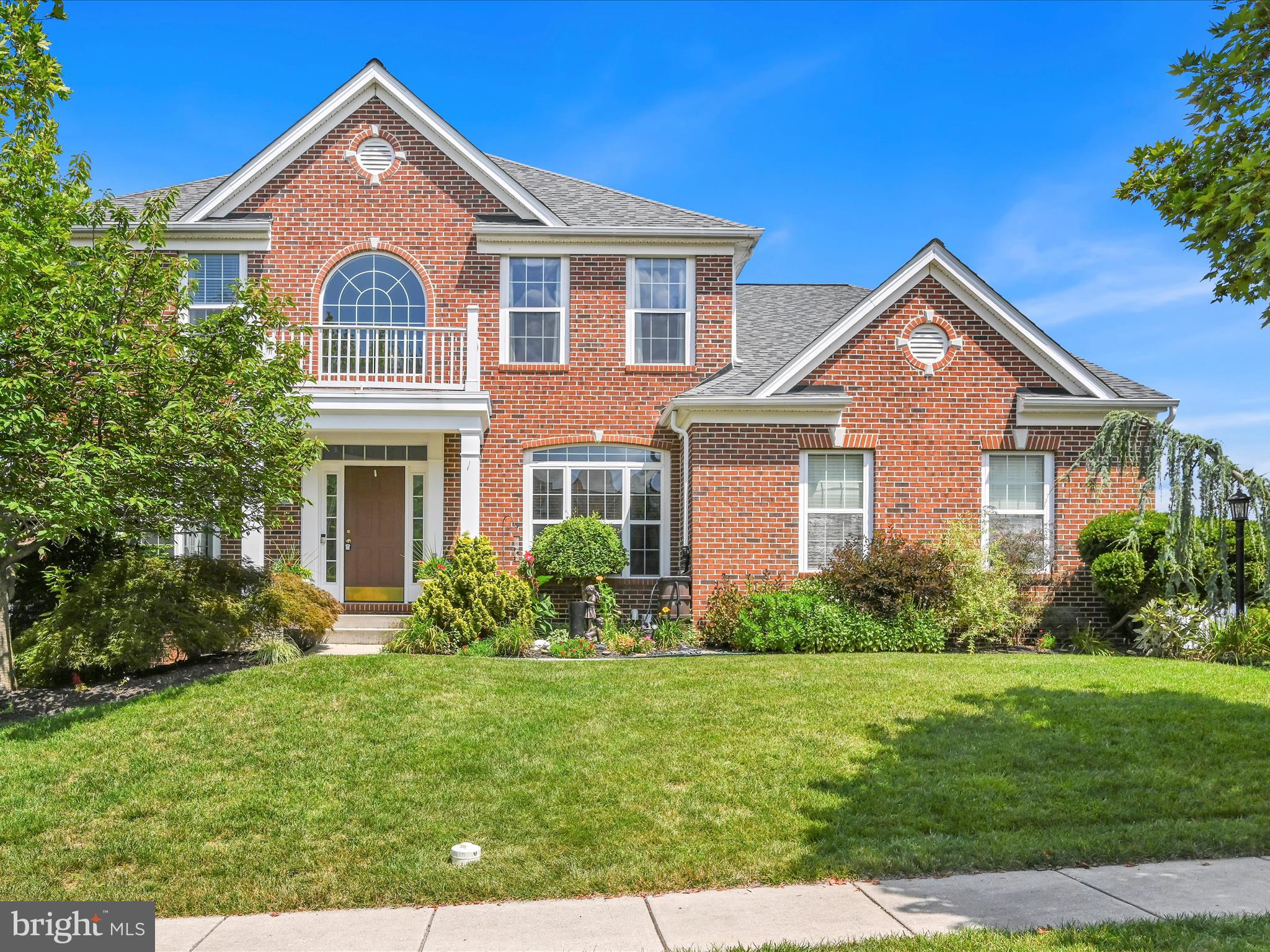 Rare opportunity awaits homebuyers seeking a beautiful, 5-bedroom, 4,000+ finished square foot, brick-elevation home in the high-demand community of Logan’s Reserve! Home Warranty INCLUDED through June 2029! The two-story foyer with large picture window welcomes you to an open main-level floor plan with hardwood floors throughout. The bright, beautiful kitchen includes 42” cabinets, stainless steel appliances, center island and gorgeous adjacent breakfast room crowned by a half-moon window. The adjoining step-down family room boasts multiple quarter round and half-moon windows and gas fireplace enjoyed from across the kitchen. A formal living and dining room with elegant chair and crown molding, a dedicated office, full laundry room with storage and a powder room complete this level. The updated midnight stair balusters invite you upstairs to enjoy the sprawling laminate flooring leading to four sizable bedrooms, including the primary suite bedrooms with cathedral ceiling, duel walk-in closets and huge tile bathroom with double sinks, soaking tub, tiled walk-in shower and separate water closet. A fabulous entertaining and gaming space awaits in the fully finished basement with bar area, movie room, 5th bedroom/exercise room and 3rd full bathroom with walk-in shower. Your private backyard retreat awaits just outside—a massive composite deck with gazebo overlooks one of the most beautifully landscaped, fully fenced yards in the neighborhood. Surrounded by mature Blue Spruce, Weeping Cherry, Magnolia, Japanese Red Maple, fruit trees and more… it’s truly a sanctuary. A lower-level stone patio with built-in fire pit is perfect for chilling or hosting friends and the rare enclosed under-deck storage with sliding barn doors adds convenience and charm. Additional highlights include new roof installed in 2021, dual heating/cooling zones, front porch and plenty of organized storage space. When things heat up, plan a dip at the community pool, workout in the gym or fine-tune your game on the putting green or full basketball court. Brand new community playground to be completed this year. You won't find more luxurious living near the MD line at this price, so scoop this one up!