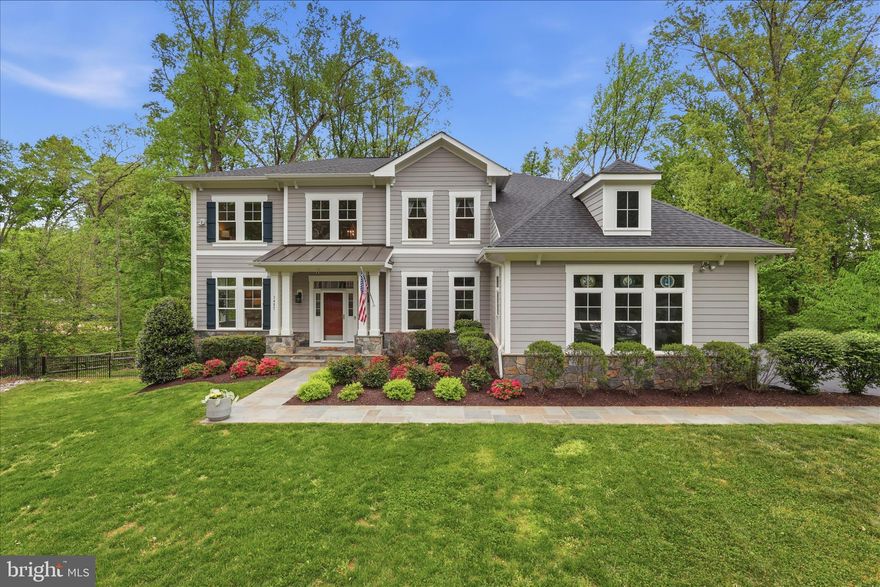 Welcome home to Barkley Oak, an exceptional 2019 Stanley Martin Craftsman residence set on nearly an acre in the heart of Mantua. From the moment you arrive, the gated entrance—framed by custom stone pillars and elegant lantern lighting—creates a grand and memorable first impression. Offering over 6,000 square feet of beautifully finished living space, this thoughtfully designed home features 6 bedrooms and 5.5 bathrooms, including a convenient main-level bedroom with a full bath. With 10-foot ceilings, a three-car garage w/EV charging, and a fully finished walkout lower level complete with a kitchenette, every detail has been carefully considered for both comfort and functionality. Inside, the home showcases high-end finishes, extensive millwork, and refined trim upgrades that elevate the open-concept layout—perfect for both everyday living and effortless entertaining. A dramatic two-story foyer welcomes you with gleaming hand scraped hardwood floors, leading to a gracious living room and an elegant dining room ideal for hosting gatherings. The gourmet kitchen is a true centerpiece, featuring quartz countertops, white soft-close cabinetry, stainless steel appliances including a double oven and gas range, a Butler’s pantry, and a spacious breakfast area. Step directly onto the Trex deck w/gas hookup for seamless indoor-outdoor entertaining.  The deck overlooks the expansive fully fenced backyard with mature trees, integrated smart multi-zone landscape lights and plenty of room to add a pool if desired. Just off the garage, a well-designed mudroom/drop zone keeps everything organized and out of sight. The adjoining family room impresses with soaring windows, abundant natural light, and a cozy gas fireplace. A powder room and the main-level ensuite bedroom add flexibility for guests or multi-generational living.
Upstairs, the luxurious primary suite offers a private retreat, complete with a sitting area, expansive walk-in closets, and a spa-inspired bathroom featuring a custom oversized shower, soaking tub, dual vanities, and a private water closet. Three additional generously sized bedrooms—one with an ensuite bath—plus another full bath and an upper-level laundry room complete this level. The finished walkout basement with 9ft ceilings and full size above grade windows expands your living space with a large recreation room, kitchenette, an additional bedroom and full bath, a bonus room, and a workshop with ample storage. Filled with natural light and designed for year-round enjoyment, this home truly has it all. A rare offering, Barkley Oak delivers the feel of a private estate while remaining just moments from everything Northern Virginia has to offer—an extraordinary blend of space, privacy, and timeless refinement.  Enjoy close proximity to the highly sought after Mantua Swim and Tennis Club and the Cross County Trail.  Ideally located just outside the Beltway with easy access to Routes 50, 66, and I-395, minutes to Inova Fairfax Hospital, Dunn Loring and Vienna Metros, and only 5 minutes to the Mosaic District with its vibrant shopping and dining. Zoned for the highly sought after Woodson High School.