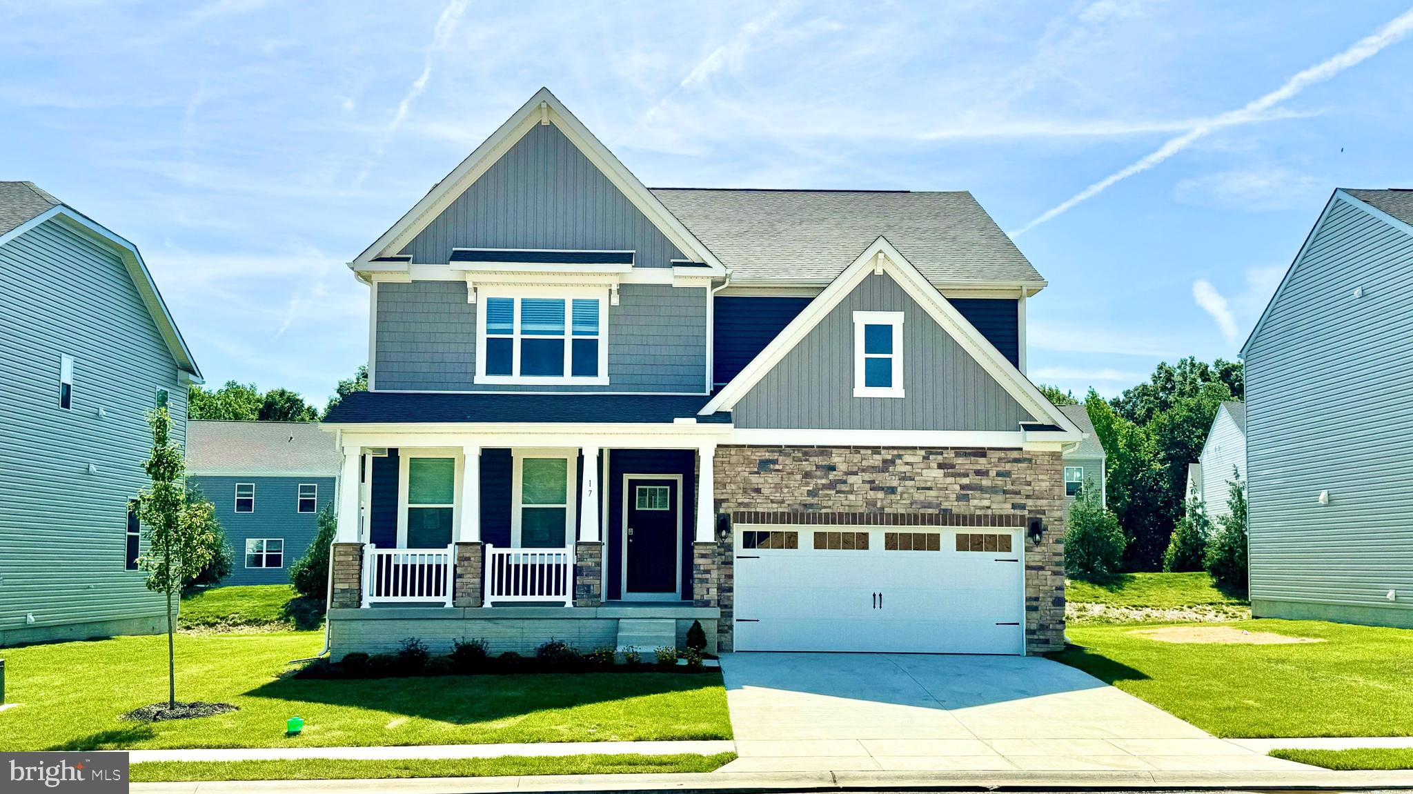 A brand-new home under construction at 28 Country Living Road, Elkton, MD, in our newest community Barksdale Crossing, is now available. The Hampshire is an exquisite home, boasting an impressive 4,279 square feet of luxurious living space. Revel in the elegance of five bedrooms, four bathrooms, a spacious loft area, and a two-car garage.
Step into the home, where a grand formal dining room welcomes guests, setting the stage for unforgettable gatherings. The foyer unfolds into a sought-after open-concept living space, showcasing a gourmet kitchen adorned with stylish white cabinets, ample quartz counter space, and a sizable, contemporary island overlooking the casual dining area and living room. A downstairs bedroom and full bath, discretely tucked off the living room, serve as a perfect guest suite or home office.
Ascend the staircase to discover a large loft area, an upstairs laundry, and three additional bedrooms, including the opulent owner's suite. This sanctuary features a cozy sitting area, an expansive walk-in closet, and a sumptuous bathroom. The allure extends to a finished basement, complete with a recreation room, an additional bedroom, and a full bathroom.
This Hampshire also includes white window treatments, an upgraded interior trim package, a fully sodded, irrigated, and landscaped yard, and the exclusive Smart Home® package through ADT giving you complete peace of mind living in your new home.
Pictures, artist renderings, photographs, colors, features, and sizes are for illustration purposes only and will vary from the homes as built. Image representative of plan only and may vary as built. Images are of model home and include custom design features that may not be available in other homes. Furnishings and decorative items not included with home purchase.