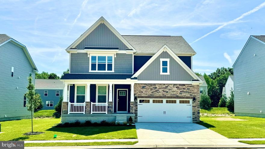 A brand-new home under construction at 28 Country Living Road, Elkton, MD, in our newest community Barksdale Crossing, is now available. The Hampshire is an exquisite home, boasting an impressive 4,279 square feet of luxurious living space. Revel in the elegance of five bedrooms, four bathrooms, a spacious loft area, and a two-car garage. 

Step into the home, where a grand formal dining room welcomes guests, setting the stage for unforgettable gatherings. The foyer unfolds into a sought-after open-concept living space, showcasing a gourmet kitchen adorned with stylish white cabinets, ample quartz counter space, and a sizable, contemporary island overlooking the casual dining area and living room. A downstairs bedroom and full bath, discretely tucked off the living room, serve as a perfect guest suite or home office. 

Ascend the staircase to discover a large loft area, an upstairs laundry, and three additional bedrooms, including the opulent owner's suite. This sanctuary features a cozy sitting area, an expansive walk-in closet, and a sumptuous bathroom. The allure extends to a finished basement, complete with a recreation room, an additional bedroom, and a full bathroom. 

This Hampshire also includes white window treatments, an upgraded interior trim package, a fully sodded, irrigated, and landscaped yard, and the exclusive Smart Home® package through ADT giving you complete peace of mind living in your new home. 

Pictures, artist renderings, photographs, colors, features, and sizes are for illustration purposes only and will vary from the homes as built. Image representative of plan only and may vary as built. Images are of model home and include custom design features that may not be available in other homes. Furnishings and decorative items not included with home purchase.