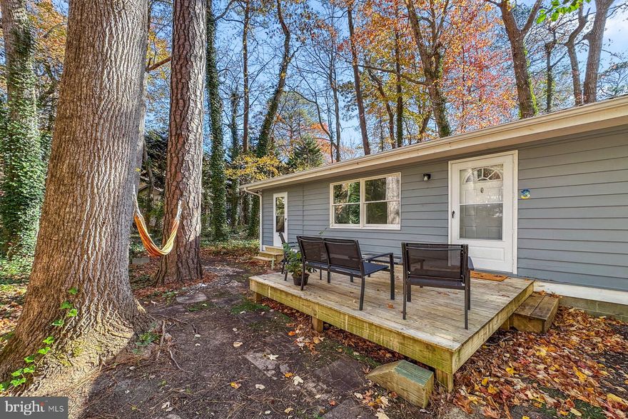 MOTIVATED SELLER! MAJOR PRICE IMPROVEMENT.  Welcome to 3 Birdnest, a charming 1973 cottage tucked away at the end of a peaceful cul-de-sac in the heart of Ocean Pines, MD. Perfect for a young couple stepping into homeownership, this 2-bedroom, 1-bath gem blends cozy vintage appeal with thoughtful modern upgrades.
Step inside to an inviting, light-filled interior highlighted by a beautifully upgraded kitchen—ideal for whipping up weeknight dinners or weekend brunches. The enclosed porch doubles as a versatile all-season room, while the outdoor deck provides a relaxing atmosphere under the canopy of mature shade trees that keep the yard cool and serene.
Nestled on a quiet street with minimal traffic, this home offers the ultimate in low-key coastal living just minutes from Ocean Pines’ pools, golf courses, marina, yacht club, tennis/pickle ball facilities and Ocean City’s beaches and endless activities . Your starter home dreams start here—schedule a showing today!