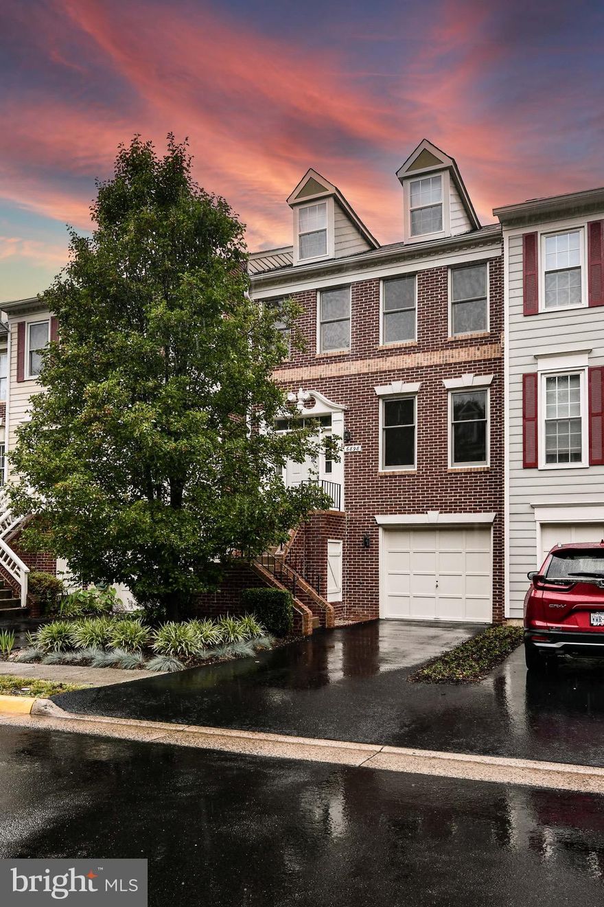 LOCATION! LOCATION! LOCATION!  Beautiful 3 level brick front townhome with one car garage.   Updates include: beautifully renovated primary bathroom, brand new kitchen stainless steel Frigidaire refrigerator, stove and dishwasher, quartz kitchen counter tops, new sliding door to deck, new carpet in recreation room, new fireplace screen and  recess lighting on 3 floors  plus every inch of the home is freshly painted interior and exterior.  Nice features include large country kitchen, built in bookshelves in living room, hardwood floors on main and bedroom levels including both stairways, lovely fenced backyard with patio. HVAC replaced in 2014.  Multiple storage areas. EXCELLENT SCHOOLS! One mile from West Falls Church Metro, plus close to shopping centers. One mile to Trader Joe's & Whole Foods and many restaurants. Four miles to  Tysons Corner Mall.