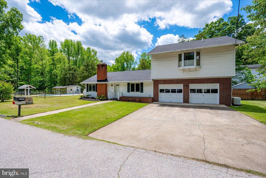 Edgewater Estate on Nearly an Acre with Pool, Guest Loft & Community Waterfront Access

A rare offering in the water-privileged community of Glebe Heights, this well-maintained property sits on nearly a full acre and offers exceptional indoor-outdoor living with timeless potential.  The main residence features three bedrooms, a large living room, formal dining room, a pristine kitchen with an additional dining area that overlooks the in-ground pool, and a bonus space suited for a home office or studio. Fresh paint and new carpet throughout most of the home.   The attached oversized two-car garage offers a private in-law suite above (access inside the home and through the garage) that includes a full bathroom, wet bar and walk-in closet.  Glebe Heights residents enjoy access to a private beach, community pier, and boat ramp, providing a true waterfront lifestyle just minutes from the shops, restaurants, and marinas of Edgewater, and a short drive to historic Annapolis.  Whether you’re looking for a multi-generational layout, investment opportunity, or a residence with space to personalize, this is a compelling opportunity in one of Edgewater’s most established waterfront communities.