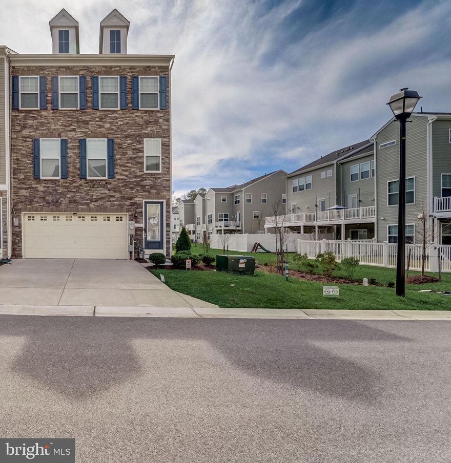 Discover luxury living in this stunning townhome located in Millersville! This expansive end-unit stands out with its impressive 24-foot width, making it one of the largest in the area. Spanning 2,520 square feet, it offers plenty of space to live and entertain. The home features 3 generously sized bedrooms, 2 full baths, 2 half baths, and a 2-car garage, combining style and practicality. The upgraded gourmet kitchen shines with stainless steel appliances, a spacious island, and elegant designer finishes. The primary suite is a true oasis, complete with a walk-in closet, a spa-like bath with a double vanity, and the convenience of an upper-level laundry room.
On the lower level, you'll find a finished recreation room with a half bath and direct access to the backyard—ideal for entertaining or unwinding outdoors. 
There is a new 20x10 full deck overlooking a spacious, fully fenced backyard—perfect for relaxation and entertaining! This energy-efficient home comes equipped with solar panels (OWNED FREE AND CLEAR), providing substantial savings even during winter months giving this home comfort, privacy, and sustainability!
The property is located at the very back of the community, giving it a very private feel. The property line expands generously into the open grass area, and also provides an additional parking spot right in front of the home. 
The community is surrounded by serene forest conservation areas and offers wonderful amenities, including walking trails, tot lots, a picnic pavilion with a grill, and a dog park. This townhome is the perfect blend of modern comfort and outdoor enjoyment!