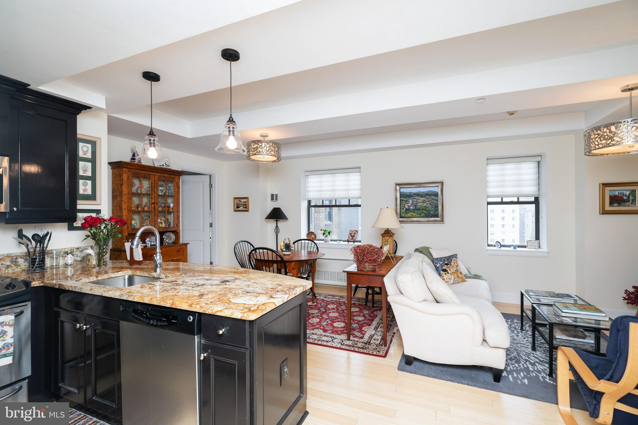 Meticulously maintained two bedroom, two and a half bathroom residence with high-end finishes and details at The Warwick Condominiums, steps from Rittenhouse Square. This spacious light-filled home offers sunrise city views from all rooms. The condominium features an open, split floor plan perfect for entertaining, while also providing the ultimate in privacy. Upon entering the home, you are welcomed into an expansive great room with a living room, dining room and chef's kitchen. The kitchen boasts dark wood cabinetry, granite countertops, GE stainless steel appliances and a breakfast bar with pendant lighting.
The primary suite has a walk-in closet and ensuite bathroom appointed in marble with a deep soaking tub. The second bedroom also has a walk-in closet and ensuite bathroom appointed in marble with frameless stall shower. Additional home highlights include bamboo floors throughout, architectural ceiling details, a powder room and a stackable washer and dryer. Residents of The Warwick enjoy the same amenities as hotel guests including a 24-hour doorman; state-of-the-art fitness room; room service, maid service, valet parking and car service for an additional fee; and the convenience of three restaurants on the ground floor. Half a block from Rittenhouse Square, The Warwick provides easy access to all that Center City has to offer, including the Market Street office corridor, Avenue of the Arts, Walnut Street shopping, Parkway museums and Amtrak's 30th Street Station.