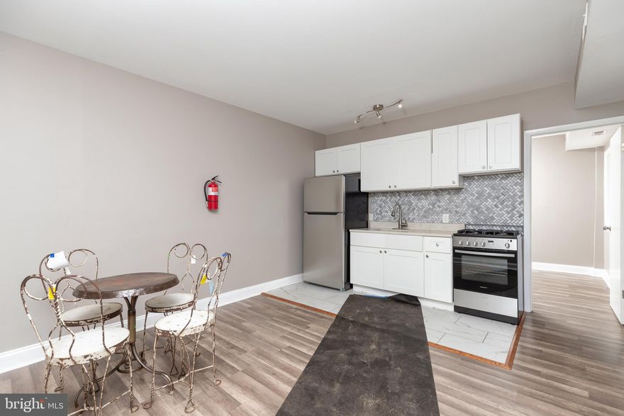 RECENTLY UPDATED 1 BEDROOM, 1 BATH APARTMENT IN THE HEART OF FELLS POINT! This is a rear main level apartment located in a 5 unit building with separate exterior entrance. Living room, kitchen w/ granite counters & ss appliances, in unit laundry, full bath, spacious bedroom, and shared rear garden patio. Conveniently located close to Harbor East, Downtown Baltimore, Johns Hopkins, and steps from Fells Point restaurants including Starbucks and shops!  Must have good credit to be considered.