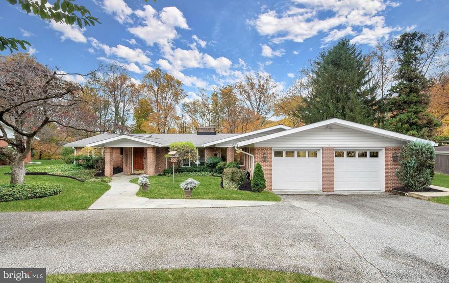 Prepare to fall in love with this spectacular sun-filled one level rancher in the sought-after Stevenson neighborhood expanded with almost 2,500 sq ft, three bedrooms and three full bathrooms set on a pristine 0.55 acre lot. Enter into the large foyer addition that showcases built-in shelving and a freshly painted neutral color theme that continues throughout. The front living room highlights a gas fireplace with brick surround and opens up into the eat-in kitchen that is fully equipped with granite counters, massive island with a second sink, tile backsplash and an oversized breakfast area for everyday meals inclusive of desk space. The open concept family and dining room boasts a soaring vaulted ceiling, wood-burning fireplace and sliding glass doors that overlook the rear yard that backs to trees with a patio and a beautiful wooded view. Your retreat awaits in the primary bedroom suite with an expansive walk-in closet and an ensuite bathroom with two vanities, a walk-in shower, a separate water closet, two skylights and a large window overlooking the woods. Another bedroom and the newly renovated second full bathroom complete this side of the home. On the other wing of the home off the kitchen, the third bedroom suite provides a private space with an attached full bath, a walk-in closet and sliders to the rear patio. Completing this home is a large laundry/mud room with a walk-in pantry closet and access to the two car garage. Recent improvements include fresh neutral paint, new carpet in the family/dining room, newly renovated second bathroom, along with upgraded electrical and plumbing, exterior lighting, copper pipe service to the house as well as HVAC, dual water heaters and gutter guards. Incredible details throughout. Enjoy the convenience of one-level living and this phenomenal location in Stevenson.