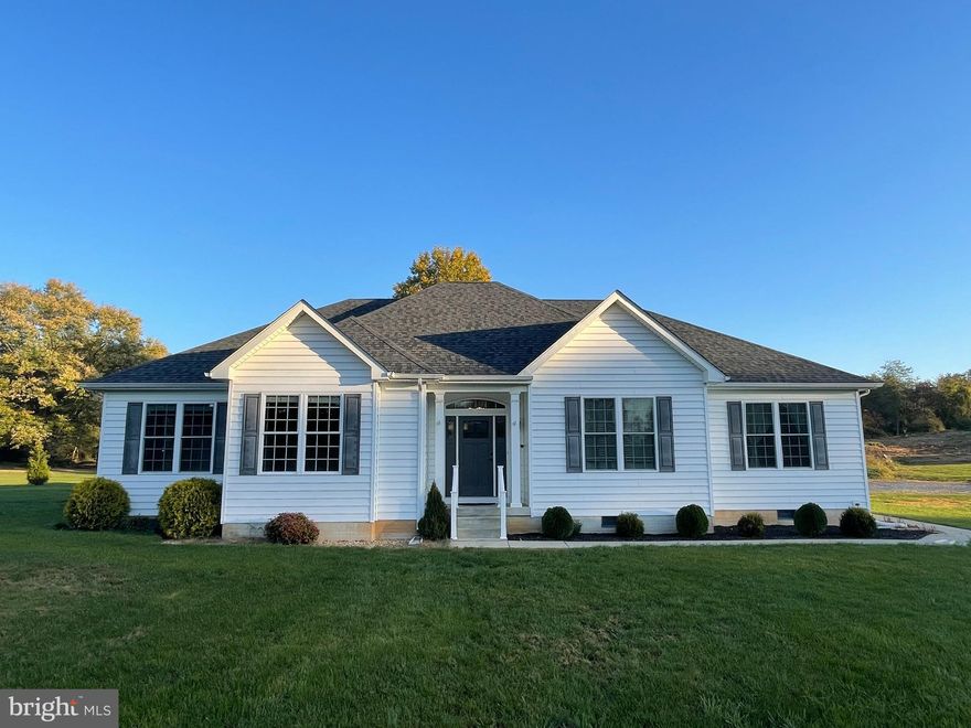 Discover effortless, one-level living in well maintained 4-bedroom, 3-bath ranch-style home with approximately 2,500 square feet of finished space. Built in 2016, this home combines modern design with classic charm. The thoughtfully designed floor plan features a welcoming front foyer, a spacious living room, formal dining room, breakfast room, dedicated office, convenient laundry room, and a walk-in pantry. The heart of the home is a bright and open kitchen that flows seamlessly onto a private rear deck, perfect for outdoor relaxation and entertaining.

Situated on a desirable hard-surface road, this property includes not one but two lots—each approximately one acre in size—offering both privacy and room to roam. Don’t miss this rare opportunity for exceptional space and layout in a prime location.