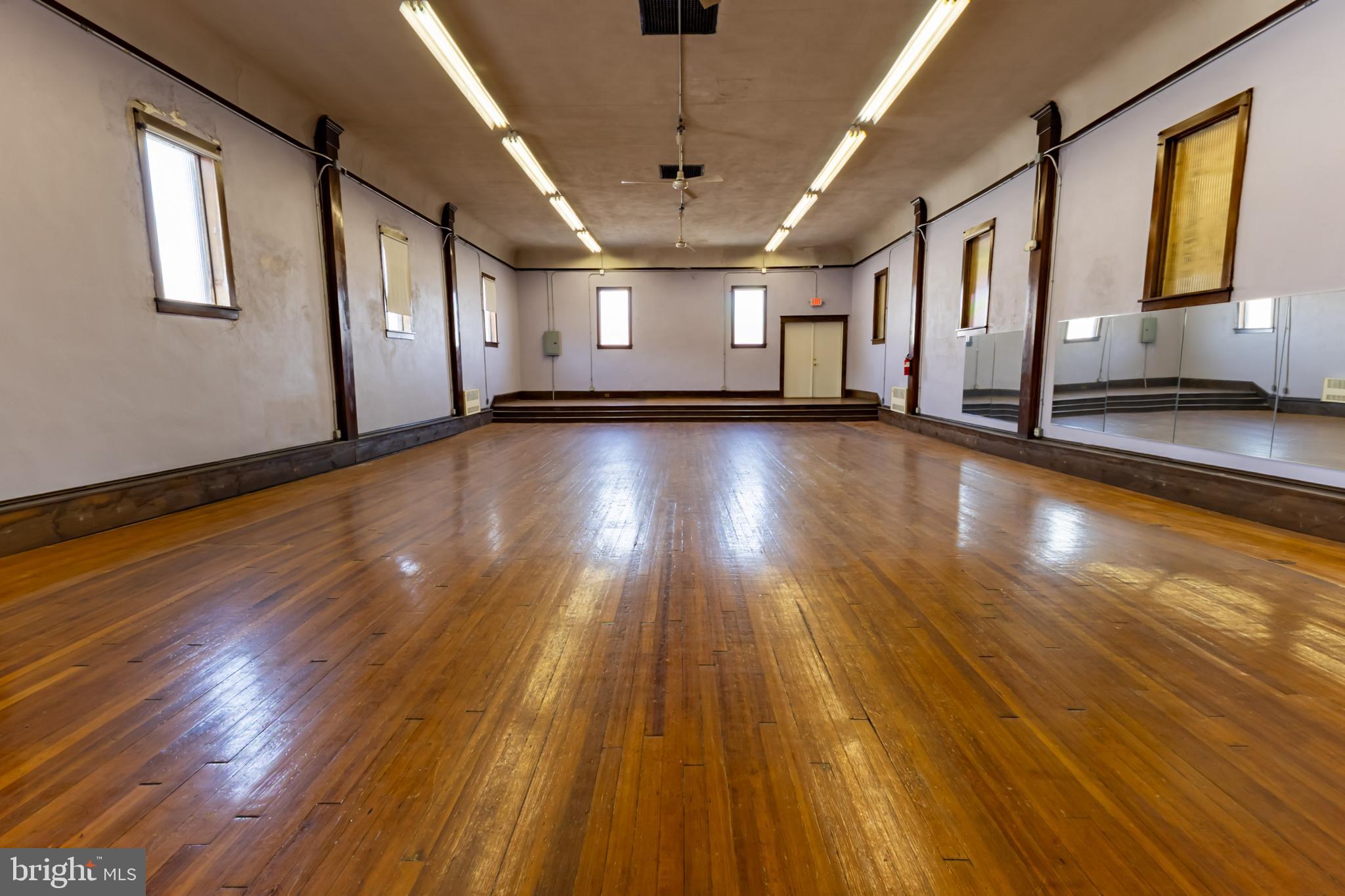 Looking to have a dance, gymnastics, or workout studio on 2nd street in Saint Clair? Look no further. This commercial space, with off street parking, is perfect for a brand new or expanding business! This space has gorgeous hardwood floors and a stage! There are two areas for seating with a bathroom. There is also a small room for an office and one for storage. If you are looking for a large open space in Saint Clair, call to schedule a showing today!
Photos by Michala Reber Photography