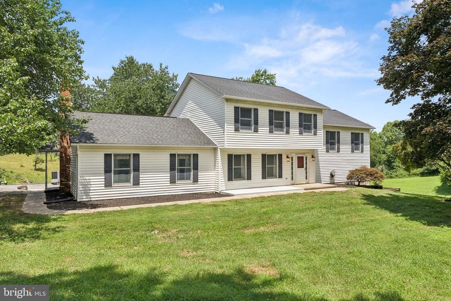 Welcome to Almost Heaven—a stunning 3.3-acre farmette featuring a unique 2,700+ sq ft custom-built 5-bedroom home, designed for both comfort and country living. This spacious property offers a warm and inviting interior with all-new neutral paint and brand-new carpet (2025), a cozy family room, a custom sunroom, and two thoughtful additions that expand your living space. Enjoy peace of mind with numerous recent updates including a water heater and sediment filter (2018), pressure tank (2025), acid neutralizer, split AC unit (2016), and a main heat pump/AC system (2019). Outdoor upgrades include a new deck and stairs (2025), concrete front patio (2025), garage roof (2025), addition-side roof (2016), and a brand-new roof and skylight on the main house (2025). The property also features a superb Amish-built 6-stall center aisle barn with water, electric, a wash-down area, tack room, and spacious hay loft—perfect for horse enthusiasts. A peaceful pond adds to the beauty and functionality of the land, and you'll love being just minutes from the riding trails at Liberty Reservoir. With a garage, open acreage, and so many custom touches, this exceptional property is truly a rare opportunity to enjoy the best of rural living.