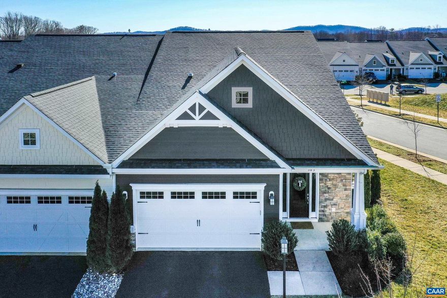 Move-in ready and waiting for you this light and bright home on a corner lot is a MUST SEE!  This like-new, main-level living home is stunning! You'll love the low-maintenance luxury vinyl flooring throughout the main level, neutral paints, and modern finishes.  The open floor plan features a white kitchen with unique "blue eyes" granite countertops, tile backsplash, stainless appliances, and custom built pantry.  Open dining room with bumped out bay window flows into the large living room. Custom white shutters offer privacy and light control! Main level primary suite features a large walk-in closet, and ensuite bathroom with double sink vanity and frameless glass shower. Main level also features a laundry room for ease.  Second floor features two bedrooms each with large walk-in closets, and a full bathroom.  Enjoy movie night or create a home office in the large loft space upstairs. Great screened porch is surrounded by lush landscaping for privacy, and patio is great for grilling.Two car garage and extra storage space upstairs off the hall bathroom. HOA maintains landscaping for ease and peace of mind! Located across from green spaces and play areas in the heart of Crozet!,Granite Counter,White Cabinets