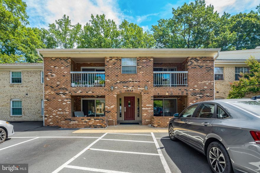 Tucked into the tree-lined tranquility of Burke Cove, this top-floor condo doesn’t just check the boxes, it dials up the comfort, convenience, and calm. Think of it as your peaceful perch above the bustle, where you can sip morning coffee on a private balcony facing the woods, surrounded by birdsong and leafy views. 

Inside, nearly 1,100 square feet of space welcomes you with rich wood floors that stretch through the open-concept living and dining area, perfect for movie marathons, weekend dinners, or just sprawling out with a good book. You can observe the calm nature through the oversized sliding glass doors, drawing your eye to the treetop view, almost a tree-house feeling if you will. 

The kitchen delivers what most buyers wish for: solid granite counters, classic cabinetry in warm wood tones, and a full suite of stainless-steel appliances, including a gas range ready for anything from lazy brunches to late-night pasta. With its convenient pass-through window and easy flow into the dining room, the layout stays connected while keeping the cooking zone private.

Down the hall, you’ll find 2 sizeable bedrooms. The primary suite includes a dedicated vanity nook, double closets, and leafy views, while the full bath serves both the suite and the rest of the unit with classic simplicity. The other extra den offers flexibility for guests, work-from-home, or creative hobbies, and a full second bath means no waiting in line. This property is being sold AS-IS. You will find space to make your own creative choices to make the home yours. 

On the lower level, your own locked storage room offers extra space for everything from bikes and bins to holiday boxes. And in the lot right outside, you’ve got one assigned parking space and plenty of extra open parking for guests.

But what really makes Burke Cove shine is the lifestyle. This beautifully kept community is tucked into a natural setting full of winding trails, lake views, and wide lawns—plus amenities like tennis courts, tot lots, two outdoor pools, and miles of walking paths woven throughout the Burke Centre Conservancy. The monthly dues cover exterior building care, trash, snow removal, water, and pool access, letting you spend less time on logistics and more time enjoying where you live.

While tucked into its own peaceful pocket of Burke, you’re still just a short drive from major commuting options, grocery stores, and local favorites like Burke Lake, the Burke Centre Library, and weekend markets. It’s the kind of spot where you can settle in, slow down, and really stay awhile. 

If you’ve been hoping for a cozy home with real breathing room, real community, and real value, you’ll feel it the second you step inside.