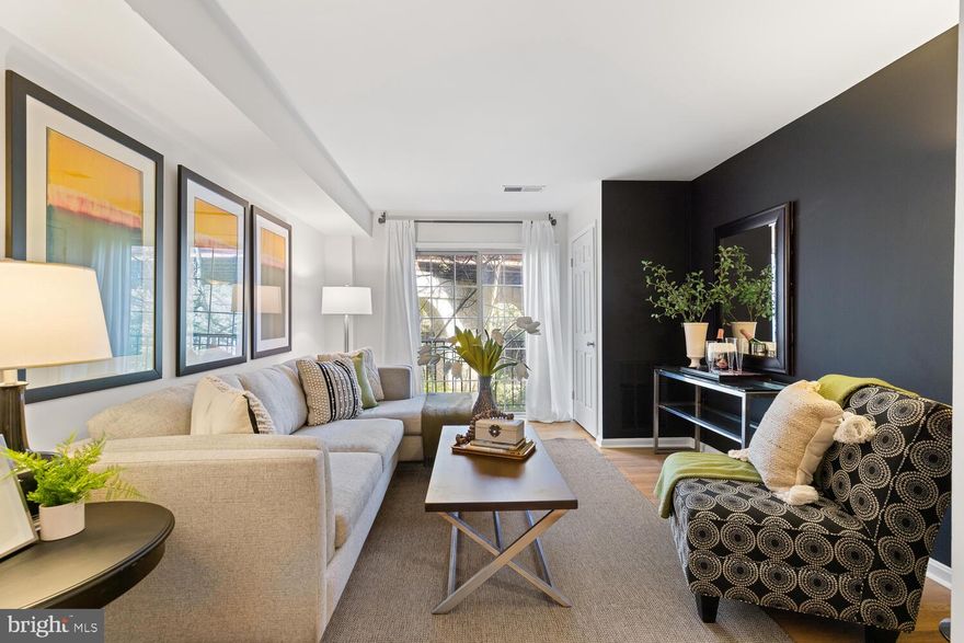 Beautifully renovated 2-bedroom condo with EXCELLENT location in Spout Run Terrace! Enjoy everything that North Arlington has to offer. Just minutes to Spout Run Park, Custis Trail, shops at Lyon Village and more! Recently refreshed with new flooring, paint, and gorgeously updated bathroom, this home is ready for move-in! Open concept kitchen and living area with views of Spout Run right outside your window. Save yourself a trip down the hall or to a laundry mat with the convenient in-unit washer and dryer. Amenities include: COVERED GARAGE PARKING SPACE, outside grill area, walking path and bike storage. A COMMUTERS DREAM! Easy accessibility to multiple commuter options, Clarendon & Courthouse metro stations, bus stops, I-66, Rt. 29 and GW Parkway. Water, trash, recycling, and snow removal included in the condo fee. UPDATES:   Fresh Paint & Flooring Throughout 2023, Updated Bathroom with Oversized Vanity, Modern LED Light Mirror and New Tile - 2022, New Refrigerator 2022, New Hot Water Heater 2021, New HVAC 2019.