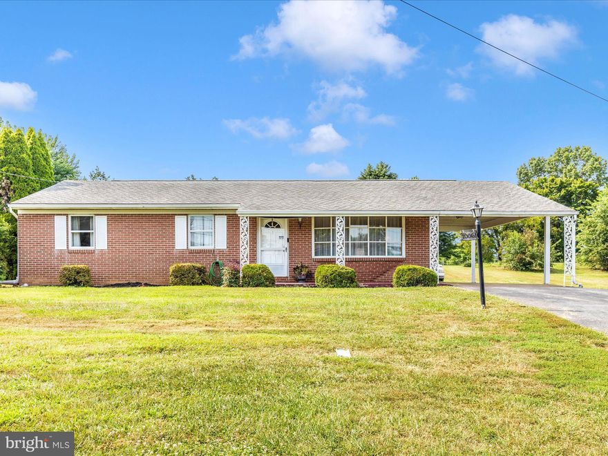Well maintained rancher in Move in condition.  3 Bedrooms, 2 Full Baths, Large Eat in Kitchen opens to a Family Room with a gas fireplace.  Separate Living Room, Screened in Porch, Laundry on Main Level (includes washer and dryer) .  A Covered Carport and Plenty of Parking on the Paved driveway.  Basement is partially finished offering a Large Recreation Room and also has plenty of extra room for storage including a cedar closet and a separate additional entrance.  Basement waterproofing system installed in 2023 includes a sump pump, Septic system updated in 2025.  Central Air Conditioning with Heat Pump and additional baseboard heating in the Basement. Nice large yard.  This lovely home has been meticulously cared for and it's ready to be yours.  Call to schedule a tour.  Conveniently located in Fallings Waters, just south of Williamsport, MD